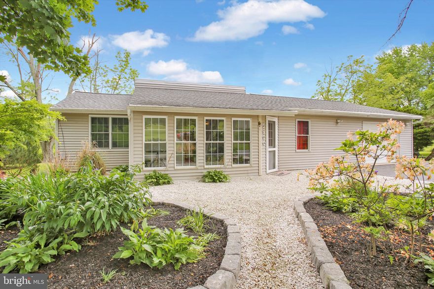 Beautiful ranch home on almost 5 acres.  This home has been tastefully updated and pride of ownership shows.  Upon entering, you walk into the bright, updated sunroom with new ceramic tile flooring and recessed lighting.  Take a step up into the eat-in kitchen which boasts Cherry cabinets, stainless steel appliances, granite countertops and ¾ inch cherry wood flooring that is insulated.  The bathroom has a soaking tub to relax on those long days.  The primary bedroom also has cherry wood flooring and an extra-large closet.  Walk down the spiral staircase to the lower level which has another bedroom and your laundry area.  The spacious living room has a coal stove for added heat as well as a new mini split system to keep the home cool in the summer and warm in the winter.  There are French doors leading out to your private deck where you can take in all the nature including a creek that runs through the property.  I'm sure you will see a deer or two as well.  The garage has a workshop area and another full bath.  A new septic system was installed in 2018 and a new roof in 2017 and the home has a back up generator included in the sale.  Schedule your showing today.