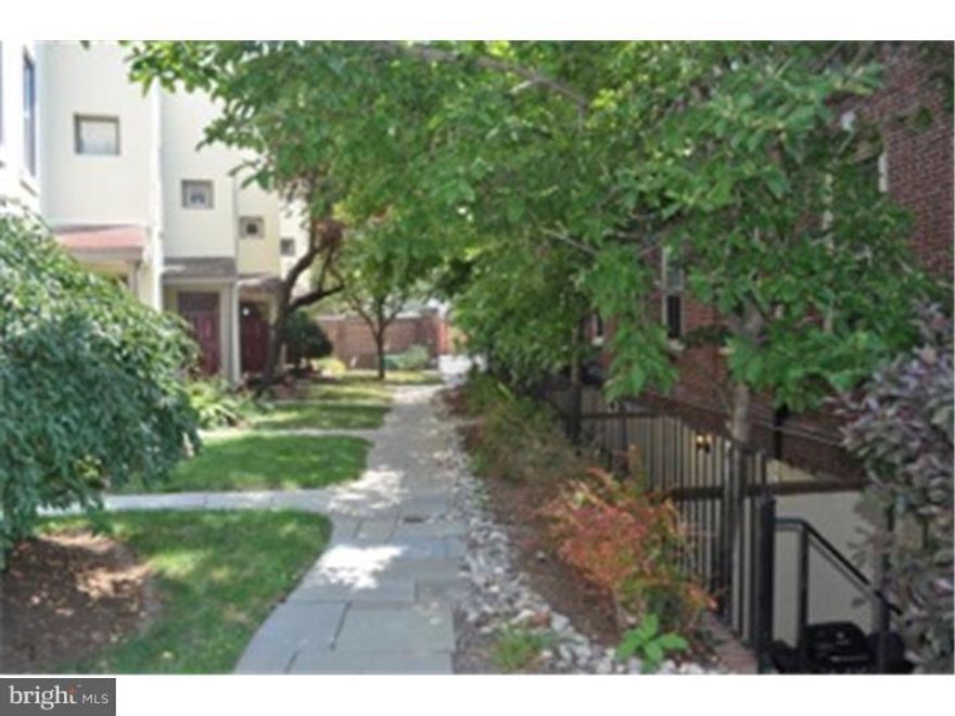 Renovated 2 bedroom, 1.5 bath bi-level apartment in Grays Court.  Grays Court is a gated community with parking in the Graduate Hospital neighborhood.  This unit has a private entrance through its personal patio area leading to an open great room with hardwood floors.  The kitchen has stainless appliances & a granite counter/eating area.  This floor also has a large closet, washer/dryer & powder room.  Upstairs there are two bedrooms & a renovated bathroom.  One bedroom has a walk-in closet & extra storage above it.  Both bedrooms have ceiling fans.  Plenty of natural light in all rooms.  The building has a complimentary fitness center. 3 months rent due at signing of lease (1st, last and security). Tenants must have average credit score.