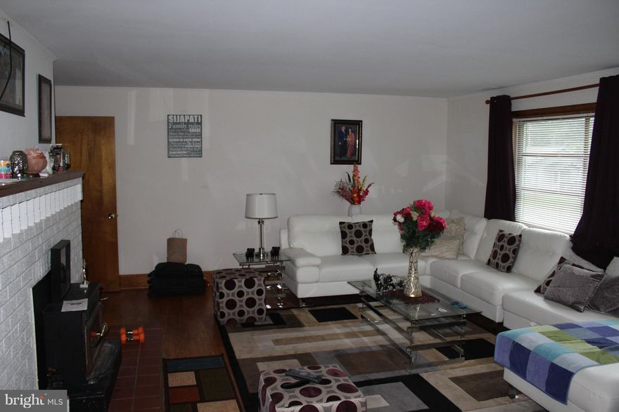 Brick Home great location, Hardwoods,  granite tops, new roof, new heat pump, 2 working fireplaces, Weather prohibits good exterior picture at this time.