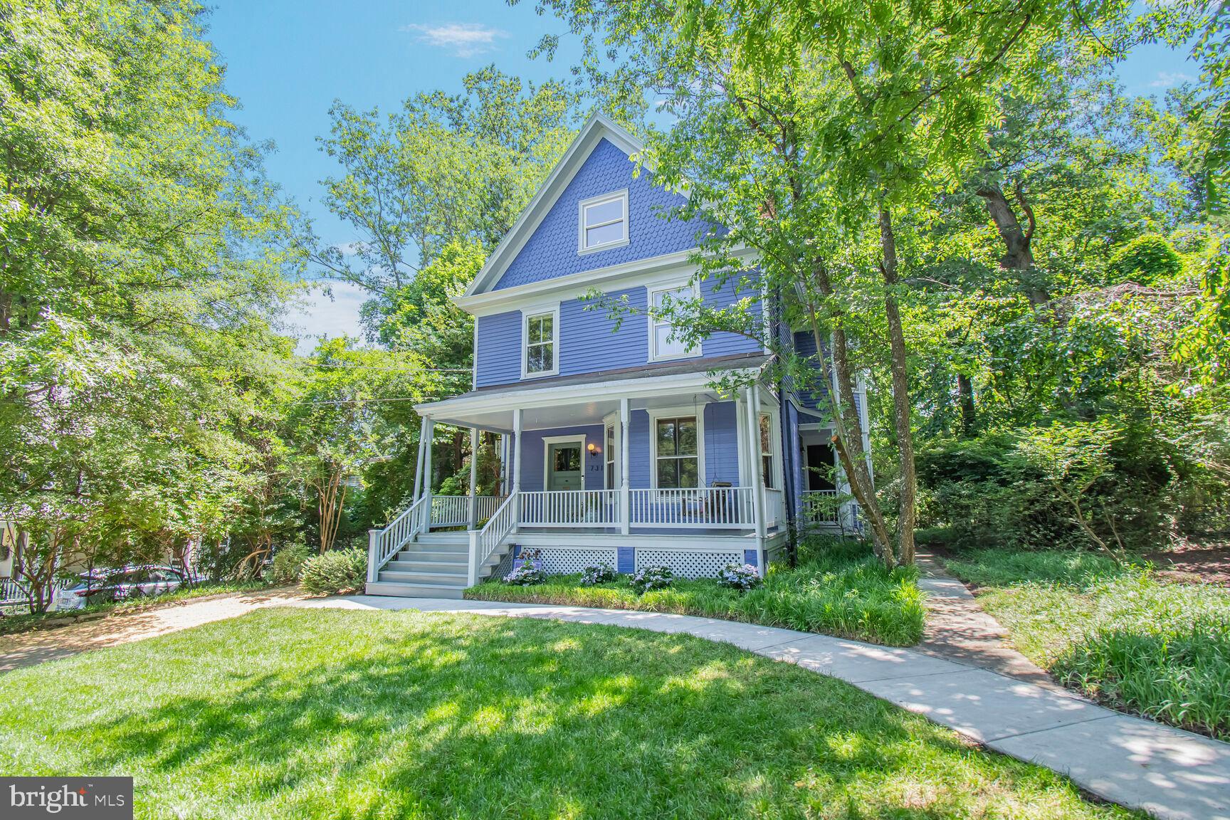 Victorian beauty! This century-old charmer, bursting with historic detail, is a Contributing Resource in the National Registry of Historic Houses in Montgomery County. Located in the historic district of the desirable and convenient North Takoma neighborhood and twice featured on the annual Historic Takoma house tour, this house is just 3 blocks to the Red LineTakoma metro stop. It boasts the largest parcel on the block, more than a third of an acre. The spacious garden is perfect for kids’ play or adult entertaining!
The house features all the charm of the Victorian age, including an inviting front porch with porch swing and formal front hall with arches, custom millwork, and original ornate barley twist stair rails. Parlor and dining room both feature pocket doors and original hardwood floors are gleaming — pine throughout the house and rare curly maple in the kitchen.
Two distinctive Rumford fireplaces with decorative terra-cotta surrounds grace the living and dining rooms. Although records show this house dating from 1908, some experts have suggested it was built during the second wave of Takoma Park development in the 1890's. Contemporary amenities include a rear addition by noted local architect Paul Treseder that created a generous-sized kitchen with breakfast area overlooking the greenery of the beautiful garden. Kitchen features ample quality hardwood cabinetry, new quartz counters, Bosch dishwasher, Jenn-Air range, and an original pantry turned baking nook.
Entertain in style in the large dining room with bay window and ornate chair rail. Off the dining room is a cozy flex room — den, office or bedroom with attached updated full bath. Upstairs are 3 good-sized bedrooms including the primary with ensuite bath and an updated hall bath. Upper level 2 is a gorgeous large loft space with vaulted ceilings, skylight, exposed beams, and original cedar closet. Currently used as a family room and office, it could also be a lovely primary bedroom. The lower level is unfinished storage space with washer and dryer. The rear yard features a beautiful patio and flower beds designed to showcase the expansive size of the lot. Two-zoned central air throughout the house and mini-split in the third level loft.
You are a few minutes’ walk to Metro and a couple more to all the amenities of Old Town Takoma Park. Whole Foods and all the amenities of downtown Silver Spring are a quick drive away. This lovely house couldn't be more convenient, yet is tucked away on a quiet street. Become the next stewards of this grand house and enjoy all the many charms that Takoma Park living offers!