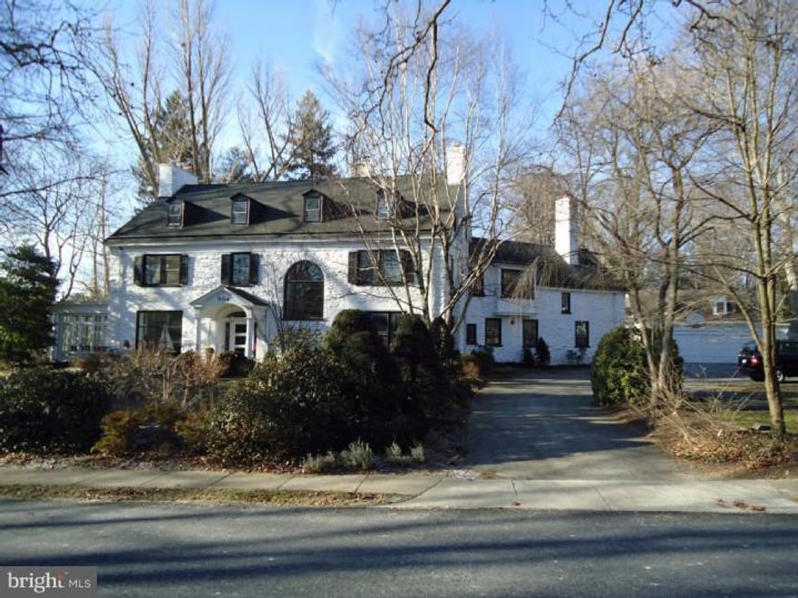 Come home every day to this elegant spacious stone Colonial; quiet neighborhood, perennial garden, pool. 1st Fl: generous Entrance Hall with wide turned stair and Palladian window; symmetrical Living Room with granite fireplace, bookcases and 2 pairs of French doors to Solarium with stone fireplace and 7 ft windows; intimate Library with stone fireplace; formal Dining Room with Adams-style marble fireplace flanked by arched, glass cabinets; beautiful maple Kitchen with multiple work centers; Family Room with desk area. 2nd Fl: Master Suite, Bedroom with marble fireplace and sitting area, Bathroom, walk-in closet; Bedroom 2 with Bathroom, Bedroom 3 with Bathroom, Bedroom 4 with custom large closet, Family Room with original cabnetry, Laundry Room. 3rd Fl: 2 Bedrooms, Hall Bathroom, Exercise Room, Craft Room. Carriage house with LR/DR, Kit, 3 Bedrooms, 2 Bathrooms, Laundry. 3 car garage. Blocks away from Merion train, Merion Elementary, shopping and only 20 minutes to Center City. Understated elegance!