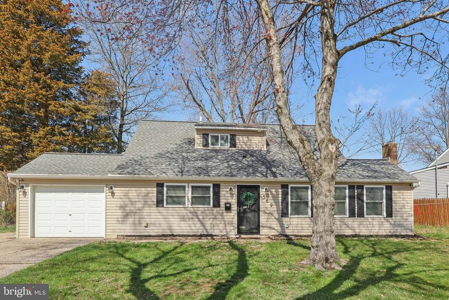 Welcome to this stunning, fully updated Cape Cod in the heart of Morrisville Boro! This charming home features an open-concept living area that seamlessly blends style and comfort. As you enter, you'll be greeted by luxury vinyl plank flooring that flows through the spacious living room and beautifully renovated kitchen. The eat-in kitchen is a true standout, boasting white shaker cabinets, gorgeous granite countertops, a chic tile backsplash, stainless steel appliances, and a convenient pantry. The living room offers plenty of natural light through several windows and is centered around a cozy brick-faced wood-burning fireplace – perfect for relaxing evenings. Sliding glass doors lead you out to a covered rear patio, where you can enjoy a large, flat backyard – ideal for outdoor gatherings or simply unwinding. On the main level, you'll find two generously sized bedrooms that share a beautifully updated full bathroom with a subway-tiled tub/shower combo. A laundry room with a stackable washer and dryer completes this level for added convenience. Access to the 1-car attached garage with a large storage closet and oversized driveway is located off the kitchen. Upstairs, two more spacious bedrooms offer plenty of privacy, and they share the second full hall bathroom, which features modern finishes. This home is ideally located, just moments from supermarkets, restaurants, parks, and all the amenities you need. With easy access to Route 1, I-295, and New Jersey, commuting and exploring the area couldn’t be simpler. Don’t miss the chance to make this beautifully updated Cape Cod your own!