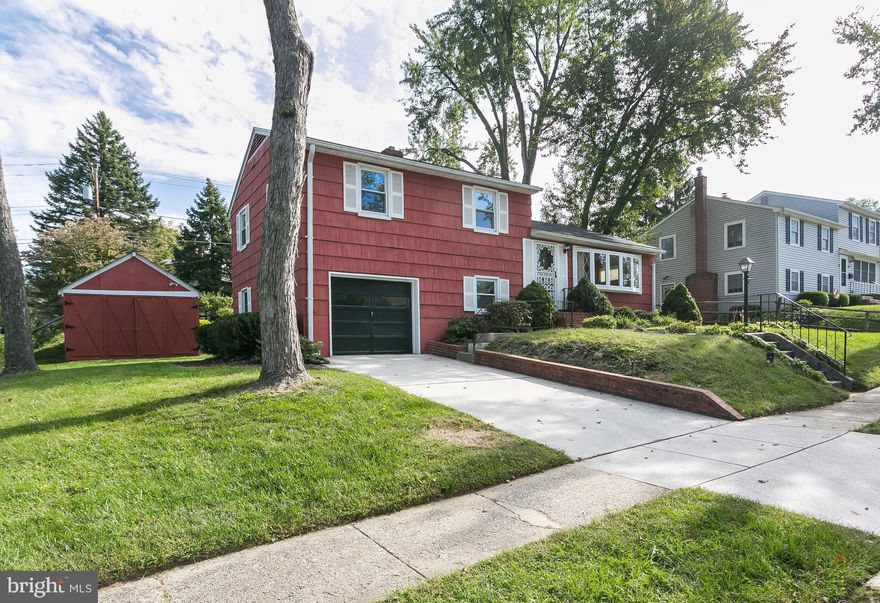 Beautiful 3BD,1.5BA split level w/ 1 car garage/driveway on a corner lot. Enclosed sunporch overlooking deck & lovely yard. Features include gorgeous refinished H/W's, new carpet on LL, roof 2015, newer replacement windows, x-large shed, bright eat in kitchen w/skylight, separate DR,and spacious LR w/huge front bow window. Wonderful neighborhood-convenient to shopping & great schools.Welcome Home!