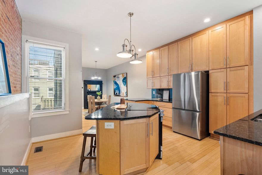 Welcome to 2328 E Fairmount Ave in Baltimore! This spacious 4-bedroom, 3.5 bath townhome offers over 3,000 sq ft of living space in the heart of the sought-after Patterson Place neighborhood. Just one block from Patterson Park, this home features an open floor plan, hardwood flooring, and a beautifully updated kitchen with stainless steel appliances.

Enjoy multiple living areas, two fireplaces, and a fully finished basement providing flexible space for entertaining, work, or guests. The home also includes a private parking pad, rear deck, and rooftop deck, perfect for city living and outdoor enjoyment. Built with classic brick and stone charm and thoughtfully updated, this home blends historic character with modern convenience.