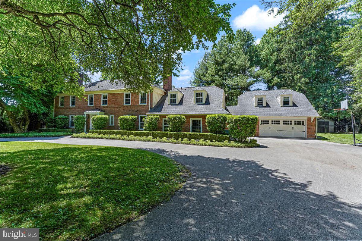 Now is your ULTRA-RARE OPPORTUNITY to own this NORTH-SIDE BRYN MAWR, STATELY BRICK COLONIAL MANOR HOME originally built by prominent Main Line developer Sherman Reed & more recently expanded & renovated by highly regarded EB MAHONEY & BLACK ROCK BUILDERS. Offering INCREDIBLE CURB APPEAL, COMPLETE PRIVACY & a RESORT-LIKE SETTING, this home is perfectly nestled on a PRIVATE & maturely landscaped 1.16 acre +/- lot w/ specimen trees, estate fencing & a SYLVAN POOL. The SETTING IS PRIVATE AND MAGICAL yet you remain CLOSE TO EVERYTHING - just minutes to the center of Bryn Mawr (R-5 train, Fine Dining, Boutiques, Mom's Organic Market, Bryn Mawr Movie Theater) & part of the nationally recognized LOWER MERION SCHOOL DISTRICT! This 6 bedroom, 5 full bath & 3 half Bath, 6000 + sq ft ALL BRICK home offers a transverse floor-plan w/ flexible layout and great CIRCULAR FLOW that is PERFECT for Grand-Scale Entertaining & Intimate Family Gatherings. Set back & nestled down a long peaceful drive you are greeted by a flagstone path accessing the gracious entrance foyer w/ gleaming refinished HW Floors, walk-in coat closet and sun-drenched interior. The large formal living room w/ walls of custom Pella doors and windows on 3 exposures offers recessed lighting & Carrara marble fireplace. Also off the center hall you will find a paneled den w/ brick fireplace, wet bar, formal guest powder rm and large formal dining room w/ French doors to the rear terrace & swing door to the kitchen. The circular flow between rooms is ideal for entertaining with the center of the home featuring a jaw-dropping Chef's Kitchen & Great Room addition w/ vaulted tray ceiling and granite fireplace flanked by built-in WoodMode cabinetry, wet bar, skylights and French doors opening to the expansive PATIO and POOL. The large eat-in kitchen features abundant custom Maple & painted Oak cabinetry, Granite counters, Entertaining Island, Walk-in pantry and Professional stainless appliances including: Dual 36" Sub Zero refrigerator freezer, Thermador cooktop, Thermador double ovens, Bosch dishwasher, Main & Prep Elkay Sinks w/ Grohe pull-out spray faucets, recessed and under cabinet lighting that opens to the Mud-Laundry room w/ 2nd powder rm, custom DOG SHOWER w/ access to the original/ 2 car garage and the SEAMLESS 2 car garage addition w/ Separate entrance w/coat closet and back stairs lead to a fully outfitted GUEST SUITE w/ Full Bath w/ Deep Kohler soaking tub/shower and full laundry rough in. A beautiful flared staircase leads to the 2nd floor featuring 5 Bedrooms and 4 full baths including the AMAZING OWNERS SUITE w/ 2 Walk-In Closets + His & Her SPA-LIKE Bathrooms & Radiant Heated Floors. The gentleman's bath features a Kohler Waterhaven Multi-Head Spa Shower, Robern medicine cabinet and no fog lighted mirrors and the lady's bath features a deep jetted Kohler Air Tub w/ glass shower, Robern medicine cabinet and wall mounted magnifying mirror & heated towel bar. Bedroom 5 offers a full bath and is accessible from this level or from the back stairs off of the laundry room. The finished lower level offers media room w/ built in sound/speaker system, recessed lighting, gym, mechanicals and storage. Additional features of this immaculate home include: Pella Architectural Wood/Aluminum Clad Windows, 4 CAR GARAGE, 3 Fireplaces w/ Peterson Real Fyre Gas Logs, 3 ZONE HVAC, 40 YEAR CERTAINTEED Architect Profile Asphalt Shingles, Oversized Aluminum Gutters w/ gutter guards, Baby-Lok Fenced In-Ground heated gunite pool w/ custom Baby-Lok Cover, new Raypak propane heater, new Pentair filter, Stamped Concrete Patio, Pelican Whole House Water treatment & Softener System, Walk-up Attic, Halo & Seagull Lighting, Baldwin Brass Door Knobs and Hinges and Smith and Noble blinds throughout. This PRISTINE home has been meticulously maintained, expertly expanded & renovated by TOP MAIN LINE BUILDERS & has been loved and enjoyed by the same family for the last 23 years - DO NOT WAIT!!!