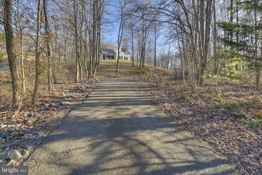 This spacious custom home is perched on a rolling wooded 2.26 acre lot just minutes from Lake Athlone. This home has a wonderful flowing floor plan with plenty of light and a 2 story living room. The main level master with updated ensuite bath & walk in closet is sure to please. Beautiful hardwood floor slow throughout the majority of the main level and into the heart of the home, the kitchen. The kitchen has granite countertops, a large island, oven with induction cooktop and plenty of storage. Also on the main level is the perfect home office complete with french doors. There are three bedrooms & an updated Jack & Jill bathroom on the upper level. The finished lower level offers access to the outdoors with sliding glass doors. The updated wet bar makes this the perfect space for entertaining family & friends. The deck located just off the back of the house is the perfect spot for backyard grilling & chilling. This property also has a front porch, the perfect spot to relax and enjoy the view of the hills of Marshall. This home is complete with a two-car side load garage.