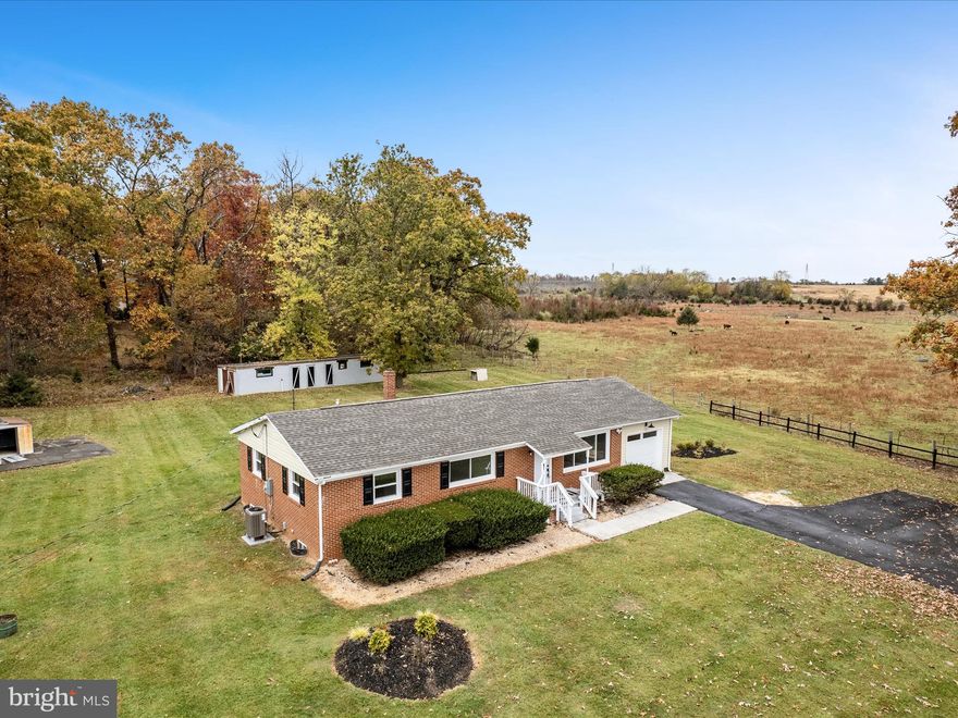 Exquisitely Remodeled Brick Rancher on Over an Acre of Unrestricted Land in Summit Point!
Experience timeless charm and modern sophistication in this beautifully renovated brick rancher, perfectly situated on more than an acre of serene countryside. Step inside to find genuine hardwood floors gracing the living room, hallway, and bedrooms, complemented by stylish luxury vinyl plank flooring in the kitchen and baths.
This thoughtfully designed home features 3 spacious bedrooms and 2 full bathrooms, offering both comfort and functionality. Enjoy peaceful pasture views from your windows and the tranquility of open space living—without the limits of an HOA.  Additional outbuilding for your animals or storage needs.
Located just moments from Summit Point Raceway, with convenient access to Charles Town, Shepherdstown, Berryville, and Winchester, this home perfectly blends rural charm with accessibility.
With numerous high-end updates throughout, this property truly shows like new. Don’t miss the opportunity to make this stunning property your next home! Fiber Available!