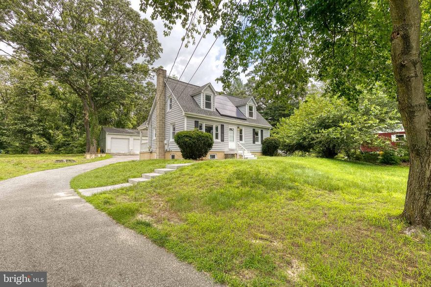 If you are looking for privacy this is it! Adorable cape cod style home on a giant lot w/2.5 car detached garage. Enjoy the sun drenched living room, updated eat-in kitchen leading to the back deck & yard + a main level bedroom & full bath. The upper level bedrooms are spacious w/great closet space & update bathroom. Oversized basement offers a ton of storage space. Freshly painted a lovely neutral grey tone and ready for move in.  Near Ft. Meade, 32, 100 & 295.