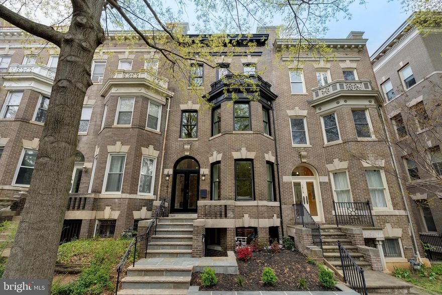 PRICE IMPROVEMENT!!! 5 STARS!!!   
Welcome to 1821 Wyoming Avenue Northwest, a stunningly renovated Georgian bayfront residence situated in the heart of Kalorama, Washington, DC. This exquisite home offers 4,010 square feet of meticulously designed living space spread over four levels, perfect for both grand entertaining and elegant everyday living.

As you enter, you'll be captivated by the main level's open layout, which seamlessly connects to a spacious patio and flat rear yard—ideal for hosting gatherings with ease. The southern exposure bathes the space in natural light, highlighting the home's remarkable features, including the beautiful coffered ceiling in the dining room and a chef's delight custom kitchen with integrated cabinetry.

This sophisticated home boasts five luxurious bedrooms and four and a half bathrooms. The primary suite is a true sanctuary with a stunning wet room featuring a soaking tub and separate shower. The top floor hosts a family room complete with a wet bar, leading to a wonderful roof deck that offers an inviting retreat.

The lower level in-law suite, accessible from both the main house and through private front and rear entrances, provides versatility as a potential income-generating space. Spectacular new wood flooring, including a herringbone pattern on the main level, adds to the home's modern charm.

Additional amenities include efficient air conditioning, a cozy fireplace, and a versatile basement. The property also features a detached garage equipped with heavy up electrical—perfect for electric vehicle enthusiasts.

Located just a short walk away from vibrant restaurants, entertainment, parks, and METRO, this home offers an unparalleled urban living experience. Discover this gem in one of DC's most sought-after neighborhoods and make it your own.