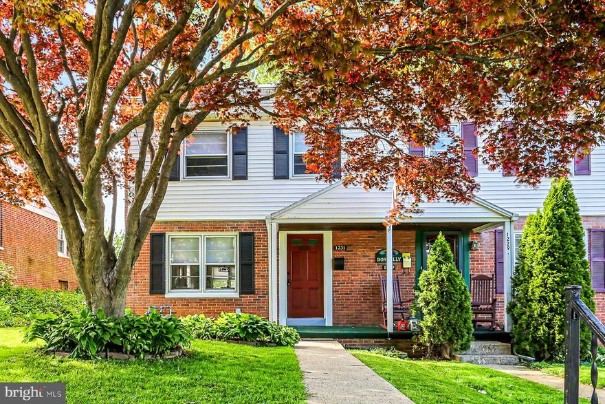 Act now before this remodeled semii on a quiet street is gone!  Newly remodeled kitchen and bath, gleaming hardwood flooring , and all new fresh paint!  This home is ready for you to step right in.  Quaint rear yard, and the possibility of off street parking too!