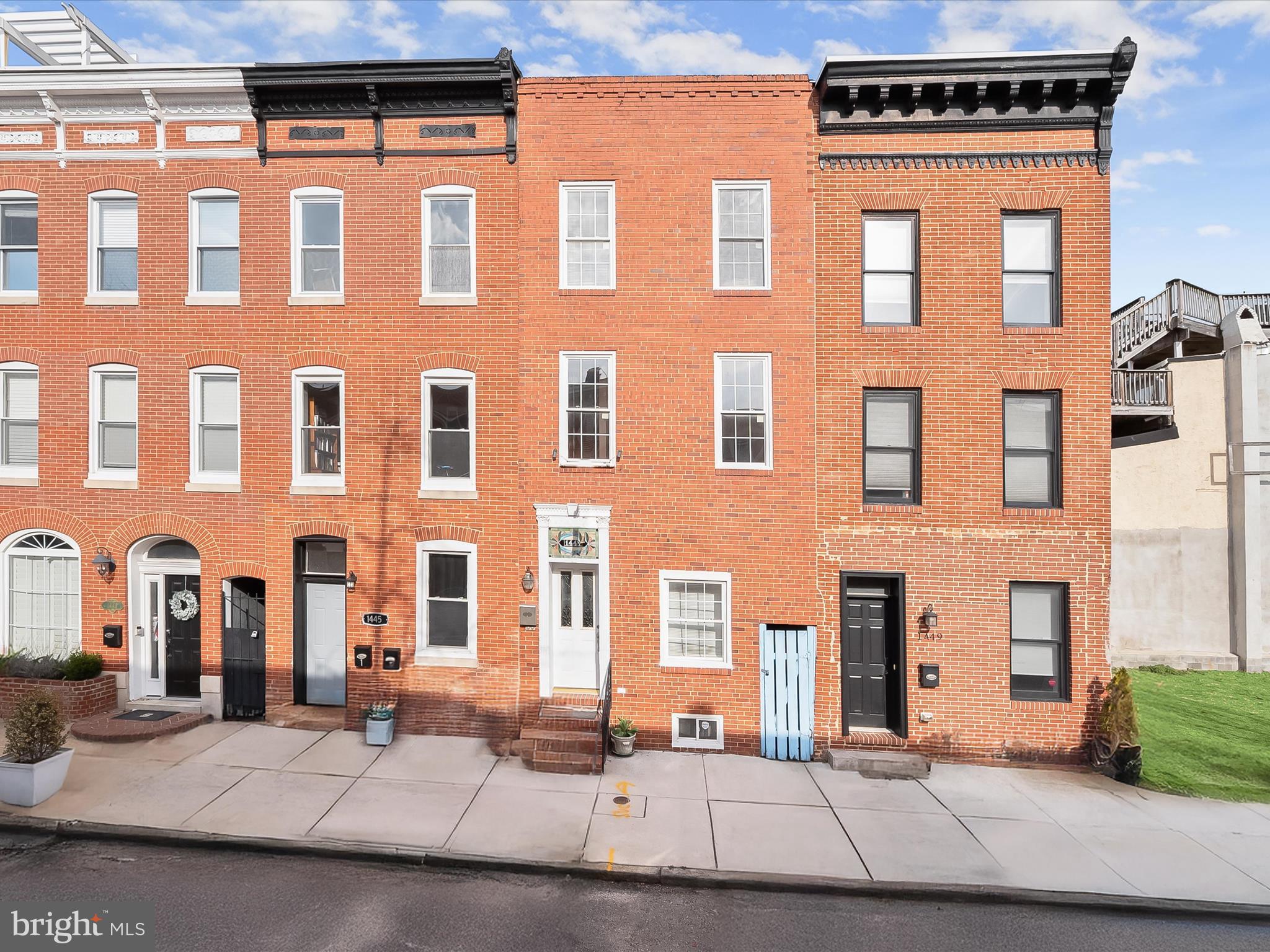 INVESTOR ALERT! POTENTIAL RENTAL INCOME OF $6500 OR MORE PER MONTH! Discover this unique multi unit investment opportunity featuring three separate units with their own entrances in the sought-after Riverside neighborhood, just minutes from Federal Hill, Locust Point, and the best of Baltimore living. This multi-unit property is currently zoned for two apartments, with the potential for a third in the rear pending zoning approval or conversion into a garage. Hardwood and ceramic tile floors, exposed brick walls, and tall ceilings enhance the interiors. The first-level apartment features an open-concept living and dining area, while the kitchen is equipped with a gas range, refrigerator, and dishwasher. A hallway leads to the bedroom and a full bathroom with a tub-shower. A laundry closet with a stacked washer and dryer completes this unit. The second apartment spans the second and third levels, offering three bedrooms and three full bathrooms. The main level includes an open-concept living and dining area, a kitchen with granite counters, and a full bathroom. A versatile bonus room with laundry could serve as an additional bedroom or flex space. Upstairs, the top level boasts a primary bedroom with a walk-in closet and an ensuite bathroom with a jetted tub-shower. Two additional bedrooms and a shared full bathroom complete this level. Accessible from the rear alley, the potential third apartment is a two-level space featuring an open-concept main level, with one bedroom and one full bathroom on the upper level. The property is currently zoned for two units, with two meters—one servicing the main-level one-bedroom apartment and the other for the three-bedroom unit. An excellent opportunity for investors seeking strong rental income potential with a flexible layout, prime location, and updated features. Some images have been virtually staged.