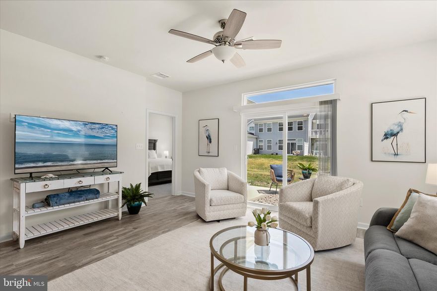 This beautiful 4 bedroom, 2.5 bath coastal style end unit villa is move in ready and set to be enjoyed for Summer 2026. In addition to the home being sold mostly FURNISHED, the seller is offering a $10,000 credit! Situated on a desirable corner homesite, this home offers low maintenance living with lower condo fees. The first floor features an open-concept layout designed for gathering and everyday living, highlighted by a spacious kitchen with a large island, stainless steel appliances, and granite countertops, A separate dining area provides additional space for hosting, while the first-floor primary suite includes a walk-in closet and private bath. Upstairs, you will find a versatile loft area, three generously sized guest bedrooms, and a full bath. The home also includes a two-car garage, adding everyday convenience and extra storage for all your beach gear.  Step outside to a concrete patio, perfect for enjoying quiet evenings after a day at the beach. Located just minutes from Bethany Beach and Fenwick Island, Friendship Creek offers convenient access to coastal dining, shopping, local attractions, and nearby beaches and bays. The community features an outdoor pool and dog park, adding to its appeal for both year-round living and seasonal enjoyment.