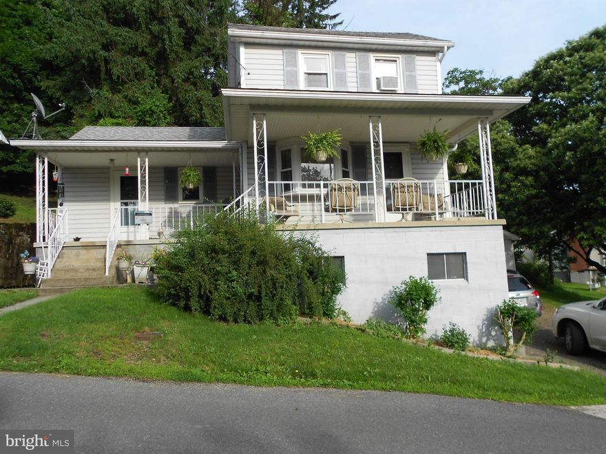 Charming 2 bedroom, 1 bath house that is move in ready.  Large country kitchen and separate dining room or use this room as an additional family room.  Also, has a large bright living room.  Two spacious covered porches. Large laundry room on the main floor.  Separate large garage.  Furnace installed in 2016.  Very well kept.  Must see.  This one is priced to sell quickly!