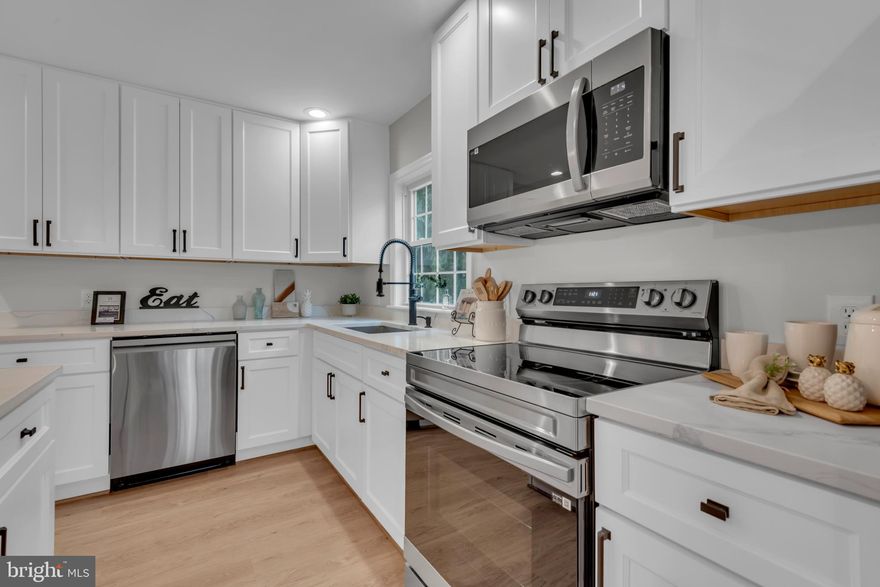 New Price | Fully Reimagined Ranch with Finished Lower Level & Modern Upgrades

Recently transformed from top to bottom, this beautifully renovated ranch offers modern style, flexible living space, and the convenience of single-level living with a fully finished lower level.

The redesigned open-concept main floor features a stunning new kitchen with quartz countertops, center island, stainless Samsung appliances, soft-close cabinetry, and a coffee bar with beverage refrigerator. New LVP flooring, updated lighting, and fresh finishes create a bright, modern living space that flows seamlessly into the family room.

Three main-level bedrooms include refinished hardwood floors and two completely remodeled bathrooms, including a primary suite bath with custom tiled shower and 72-inch double vanity.

The fully finished basement adds significant living space with a large family room, game room, full third bath, and a new laundry area, making it ideal for guests, recreation, or multi-generational living.

Major upgrades include new roof, updated electrical service and panel, new HVAC ductwork, new septic tank, rebuilt front porch, resurfaced deck, new exterior doors, improved drainage with full perimeter French drains and dual sump pumps, plus refreshed landscaping and parking area.

Move-in ready with the feel of a brand-new home and room to grow.