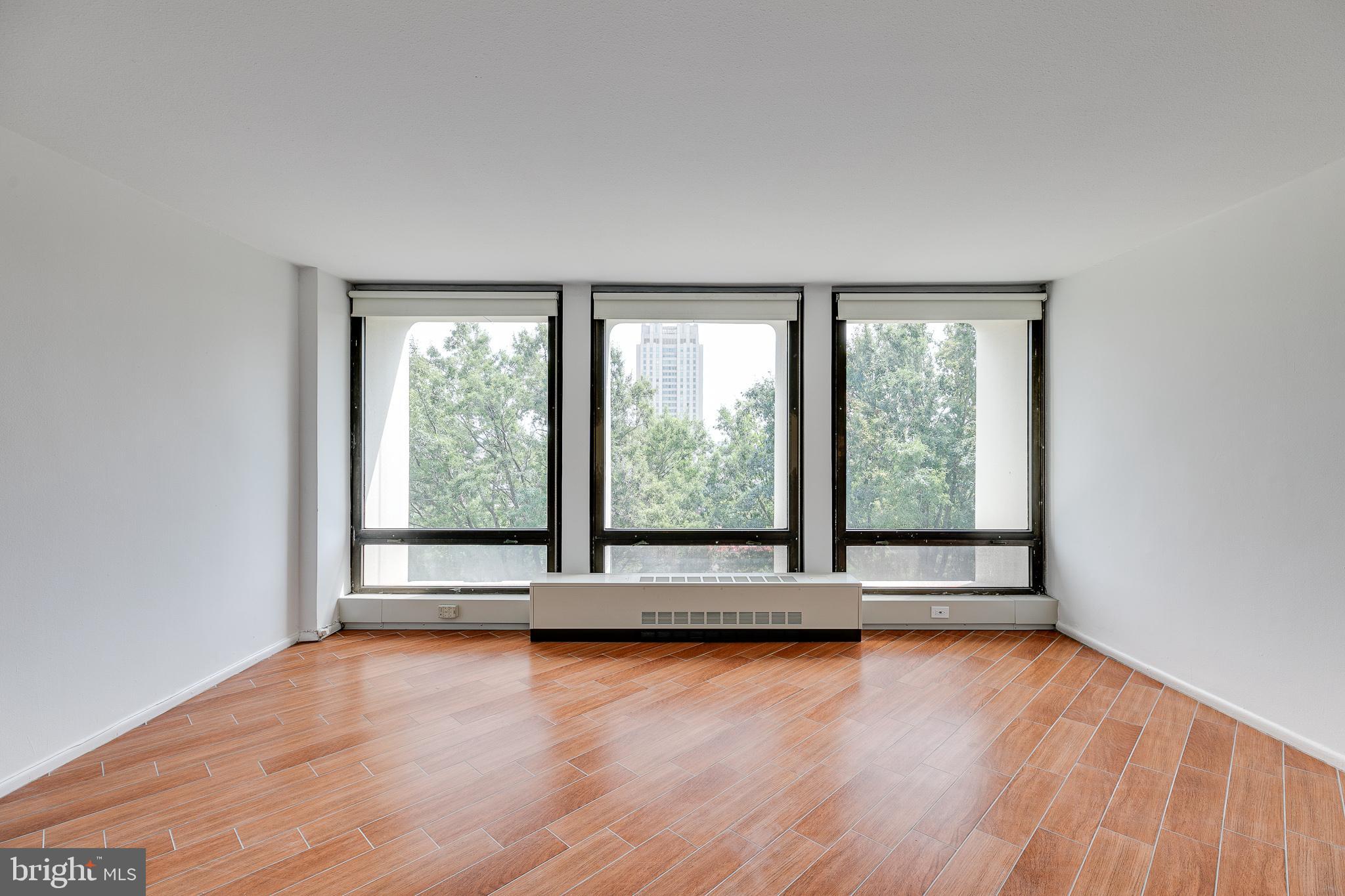Enjoy stunning treetop views of the Delaware River and Ben Franklin Bridge. This one bedroom, one bathroom has been updated throughout. The open floor plan includes a living and dining combination and generously sized bedroom. As a resident of the Society Hill Towers you’ll enjoy a twenty-four doorman, basic cable and all utilities are included. Access to the building's outdoor seasonal pool, fitness room, storage lockers, and underground parking garage are available for additional fees. Rent includes water, hot water, heat, A/C and gas for cooking. Centrally located, the Tower’s neighbors include Washington Square park, Spruce Street Harbor Park, Independence Park and others. In addition, you are steps away from Philadelphia’s historic treasures, commerce, fine dining and many diverse cultural venues. Parking options available for$240-$310 per month. Gym $330/year. Pool $325/season. Available October 1st, 2023.