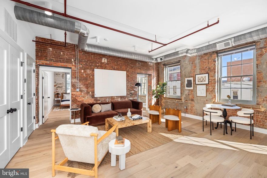 Welcome to this amazing corner unit that perfectly blends historic charm with modern amenities! This apartment is just moments from the metro, bus lines, and the vibrant shops and restaurants of King Street.  With stunning exposed brick walls, this 2-bedroom, 1-bathroom rental home offers a unique and inviting atmosphere that you will love coming home to. Bask in the abundant natural light streaming through the expansive windows, creating a bright and airy living space. Enjoy the flexibility and spaciousness of an open floorplan, perfect for entertaining or simply relaxing in comfort. The heart of this home is the large kitchen island, providing ample space for meal prep, dining, and gathering with friends.

Experience the rooftop deck with breathtaking views, providing an ideal space for unwinding or entertaining outdoors. The in-unit washer and dryer add convenience to your daily routine, and the building offers both elevator access and a modern community gym. If you require additional space, paid storage solutions are available. Parking is conveniently located nearby for rent, ensuring easy access to your vehicle. This rental offers more than just a residence—it’s an elevated way of living. Immerse yourself in the historic charm and vibrant lifestyle of Old Town Alexandria, making this exquisite home your perfect urban retreat.