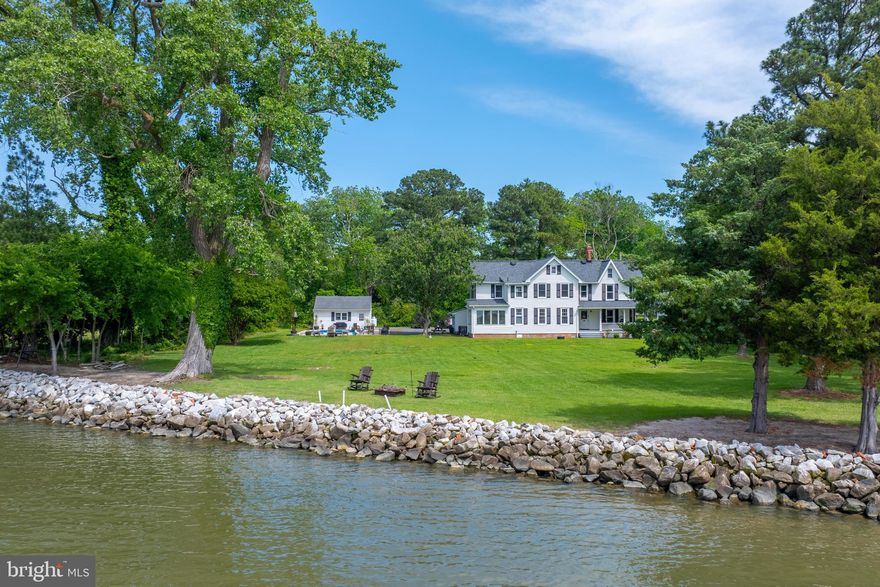 Stunning Waterfront Victorian on the Nanticoke River aka Sarah E. Travers House c. 1890-1900
This beautifully updated Victorian estate sits on over an acre along the serene Nanticoke River, complete with a private sandy beach, in-ground pool, and panoramic water views all the way to the Chesapeake Bay. Blending timeless character with modern convenience, this move-in-ready home offers the perfect balance of charm and functionality.

Whether you're searching for a weekend escape just a couple of hours from the DC/Baltimore metro area or a full-time Eastern Shore retreat, this rare offering checks every box. The spacious interior features 4 bedrooms and 2.5 baths, including a beautifully updated full bath on the first floor. Enjoy formal living and dining rooms, a chef’s kitchen with granite countertops and stainless steel appliances, and a bright waterfront sunroom perfect for relaxing or entertaining.

Throughout the home, you’ll find classic details like chair rail and crown molding, while large windows frame stunning river views from many rooms. Upstairs, four generously sized bedrooms are filled with natural light, along with a second full bath featuring a tub/shower combo. An additional half bath on the main level add convenience.

Outdoors, unwind on the wraparound porch, soak up stunning sunsets, or take a dip in the pool. A detached two-car garage provides extra storage space.  Located on a quiet no-through street just minutes from dining, shopping, and local events, this is waterfront living at its finest. Nanticoke Harbor is located less than .5 mile away via Nanticoke Road. Home to both commercial and recreational boaters, Nanticoke Harbor provides two boat ramps, a loading ramp and 68 boat slips along the Nanticoke River. There is also a pavilion situated on the water's edge and a secluded beach area perfect for fishing.

Don't miss this extraordinary opportunity—schedule your private tour today!