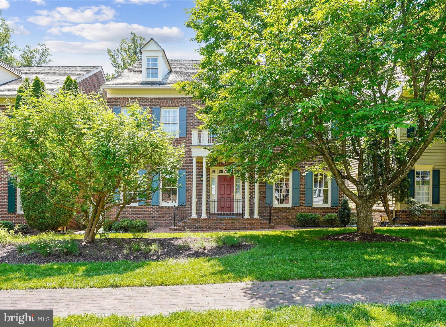 Prepare to be amazed… A HOME OF DISTINCTION... Quality in the details. Craftmark Rosewell model with custom features throughout, in the cloistered community of Williamsburg Commons. This is a private enclave where you can enjoy an exquisite life & a unique sense of belonging. Hard to believe you’re just a short walk to the Vienna Metro. This elite gated community is a well-kept secret: 38 homes are thoughtfully sited around a colonial-style green, encouraging a sense of community. Each home is unique and curated to perfection. … Enjoy the freedom to turn the key and leave on vacation, confident in the security of your home, nestled in this elegant leafy gated retreat. A sense of tradition envelopes you as you pass through the transomed front door with sidelights into a welcoming Foyer. With exquisite architectural details, this home exudes quality and attention to detail. Deep Crown molding and gleaming hardwood flooring span 2 levels. A columned Living Room overlooks the green and is open to the formal Dining Room where a 2-tiered chandelier will cast a warm glow on your dinner parties, while art spotlights throughout the home will showcase your collection. The gourmet kitchen will impress the most discerning chef with an abundance of cherry cabinetry, the granite countertop providing seemingly endless prep space, & the copper backsplash creating a stunning ambiance. The pantry is outfitted with an organizing system and easily holds all the ingredients for your next dinner party. The Kitchen is well-appointed with high-end SS appliances... a Viking 6 burner Gas range with grill and range hood and a Sub Zero built-in refrigerator. A wine cooler stores a selection of wines from your lower level wine cellar (about 2,200 bottles!). The Family Room is stunning, presenting a gas fireplace with a handsome mahogany surround. Art spotlights showcase your favorite pieces. A main level Study offers a quiet spot to look out over the green to catch up on some work. An elegant Powder Room completes the main level. Two staircases ascend to the upper level, one from the foyer & a private staircase from the Family Room. The upper level offers crown molding & hardwood flooring. The spacious landing is an ideal reading nook or gallery space. An enormous Primary Suite with Sitting Room, Dressing Room & 3 walk-in closets with organizers creates a private retreat. The Primary Bath is spa-inspired & exudes quiet luxury, offering a boutique-style triple mirrored entry, walk-in shower, soaking tub, 2 cherry vanities and a private water closet. There are 3 spacious ancillary Bedrooms (2 with walk-in closets). One enjoys a private Bath and 2 share a Jack 'n Jill Bath. The windowed Laundry Room rounds out the upper level. The expansive lower level offers a large Rec Room, Game Room, Den/Guest Room with walk-in closet (with organizer), attached Full Bath and (the piece de resistance!) Wine Cellar. Enter the Wine cellar through a stunning winery-style wood door to walls of redwood racking for approximately 2,200 bottles. A central tasting table with even more redwood racking is adorned with a granite top. The room is cooled so your wine is properly stored to age so you can grab the perfect bottle for every occasion. There is more than ample storage space reserved and plenty of shelving for all your seasonal items. Outdoors you’ll find perennial gardens, a brick Patio & a community green lined with trees, garden beds & charming garden benches. The community also enjoys a pool & pool house. The cloistered community of Williamsburg Commons, a private enclave where you can curate life on a higher plain. Hard to believe you're just a short walk from the Vienna Metro, Tysons & easy commute to DC and Dulles International Airport. Oakton High School. Live life as it was meant to be enjoyed!