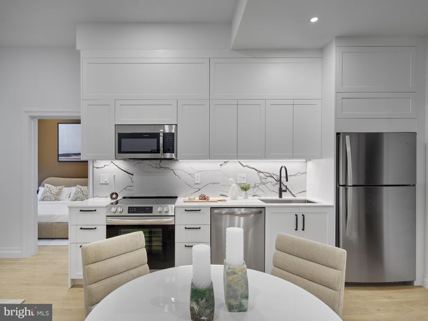 One Thousand One stands as Philadelphia’s newest and most sought-after address, connecting the city’s most-desired neighborhoods. With an unrivaled scale of world-class indoor and outdoor amenities, including a rooftop garden-inspired Pool Club, along with a Giant supermarket and curated neighborhood retail, One Thousand One emerges as a residential destination poised to leave a lasting impression on the Philadelphia skyline.

Custom split cabinetry, upgraded panel-ready appliances, and sleek, wet bars and chef-quality kitchens set the stage for inspired living. Our three and four bedroom penthouse go even further with premium upgrades like large freestanding tubs in the master bathroom, built-in pantries, and built-in double ovens with a cutting-edge diagonal convection system. Step into a home that’s as bold and sophisticated as you are.
Choose from three distinct design palettes: Parisian, Californian, and Fusion. Whether your aesthetic is refined, relaxing, or culturally inspired, we’ve curated something for every taste.

Kitchen:
Imported, craftsman-quality Italian kitchen cabinetry in every unit with ample storage, including lift-stay cabinets above the refrigerator.
Deep undermount sink with integrated garbage disposal, high-quality pullout faucet, and recirculating central hot water system delivering instant, unlimited high-pressure water.
Full-height stone backsplash and under-cabinet lighting.
Marble quartz countertops provide a beautiful workspace while being stain-resistant and anti-microbial.
Appliances include slide-in ranges with front controls, stainless steel dishwashers, and refrigerators.

Bathroom:
Large format porcelain tile throughout the entire bathroom
Extra-large vanities with integrated sink trough have extensive storage and counter space
Custom-designed storage medicine cabinets with thoughtful indirect light source to provide flattering and even lighting ideal for grooming, self-care, and make-up application.
Extra large showers with thoughtful built-ins including benches and recessed product niches for grime-free storage.
Amazing shower experience with thermostatically-controlled high pressure body jet systems in all bathrooms, and full height glass and transom doors to control steam during and after showering.
Select apartments have bathtubs, which are all extra long, wide, and deep soaking tubs, with double the volume of standard tubs.
Waterfall rain showerheads, hand-held spray wands, and body spray jets
Hot water comes on instantaneously at every fixture, at excellent pressure, and never runs out.
Integrated task lighting throughout

Living Areas:
Brazilian white oak floors with a beautifully soft and touchable oil-rubbed matte finish.
Floor-to-ceiling tilt-turn casement windows offer exceptional noise, draft, and insulation characteristics while being easy to use.
Ceiling integrated shade pockets with accompanying roller shades and integrated roller shade lighting provide seamless and beautiful privacy and solar heat regulation.
Carpentry detailing, including custom trim profiles and custom-matched hardware
Large walkthrough closets with custom woodgrain organizational fittings, integrated lighting, built-in mirrors, and optimum storage layout.
Extensive warm-toned recessed LED lighting in every room including all living and bedroom areas.

2 MONTHS FREE! *pricing inclusive of current offers. Pricing is subject to change at any time - please inquire within.
$1,500 Rent Credit for Medical Professionals
$1,000 Rent Credit for Education, and City Workers