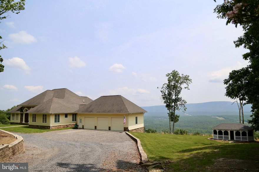 Exquisite, Resort-Quality 4Bd/3.5Ba 6,000 Sqft Home on 32.18 Acres Boasting Spectacular Panoramic Mountain and River Views in a Highly Esteemed Gated Community.
Indulge in serene living surrounded by nature's beauty while enjoying the utmost comfort and elegance. The interior of this remarkable home offers a range of exceptional features, including custom milled crown molding and baseboards, tray ceilings, recently polished travertine marble floors, and stainless appliances (including a new refrigerator). Other notable highlights include a Jack-and-Jill bathroom, a formal office, a family room fireplace, an in-law basement, a mirrored exercise room, a main level laundry with sink and cabinets, and granite countertops throughout.
The Primary Suite is a sanctuary of luxury, featuring a Jacuzzi tub, radiant floor heating, a built-in dresser, dual vanities, a walk-in shower, marble countertops, and patio access.
Outside, the property boasts an array of impressive exterior features, including a detached gazebo, two patios, decorative pillars/columns on the front porch and lower patio, an attached 3-car garage, and a 3-bay oversized detached garage/workshop. The property also offers a circular driveway, an electronic gated entrance, security cameras, security lights, a partial stone exterior with Hardie plank siding, a retaining wall, a whole-house generator, smart two-zone thermostats, ADT monitored security, smart lighting, and a video surveillance system.
Additionally, the HOA takes care of all road maintenance within the gated community, provides trash services, and offers an enclosed post office building for residents' convenience.
Don't miss the opportunity to explore your future home by visiting the 360 Tour Link today.