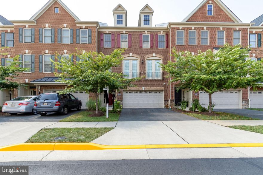 Stunning 3 Level Brick Front Townhouse. A Magnificent Gourmet Kitchen with a Huge Island, Granite Countertops, High-End SS appliances and Premium Engineered Hard Wood Floors. Spectacular Master Suite with Tray Ceiling & Private Balcony! Master Bath has a Shower w/Seat. Finished Lower Level w/Recessed Lighting and So Much More. Large Trex deck. Backs to Trees. Whole House Water Softener, Whole House Water Filtration, Custom Blinds, Nest Door Bell & August Security Lock on the Main Entry Door. This is A Must See and it Feels like a Single Family Home with no Yard Maintenance, which is covered by the HOA.