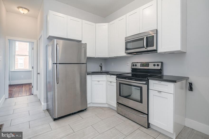 *Available 6/1*
This gorgeously renovated unit includes 2 bedrooms and 2 full bathrooms with hardwood flooring in the living spaces and bedrooms, and ceramic kitchen and bath floors. The new kitchen has granite countertops, stainless steel appliances including built-in microwave, refrigerator, and oven/range. Both bedrooms include closet space. Large windows provide lots of natural light, and you can soak up the sun in the large shared back yard and patio. With central air, and access provided to basement for laundry and storage, this unit is waiting for you to move right in. This property is near the Temple Station Regional Rail Line and several bus routes, providing easy access to the nightlife such as walking distance to St. Benjamin's Brewery at 5th and Cecil B. Moore and shopping in Northern Liberties, Fishtown or Center City.
Lease Terms: Generally, 1st month, and 1 month security deposit due at, or prior to, lease signing. Other terms may be required by Landlord such as last month's rent upfront. $65 application fee per applicant. Tenants are responsible for: electricity, gas (if applicable), cable/internet and $10/mo technology fee. Water is a flat monthly fee of $75. Additional fees or requirements may be applicable for units with Homeowners or Condo Associations. Landlord Requirements: Applicants to make 3x the monthly rent in verifiable gross income, credit history to be considered, no evictions within the past 5 years, and must have a verifiable rental history with on-time rental payments. Exceptions to this criteria may exist under the law and will be considered. Cosigners will be considered.
*Sorry no pets