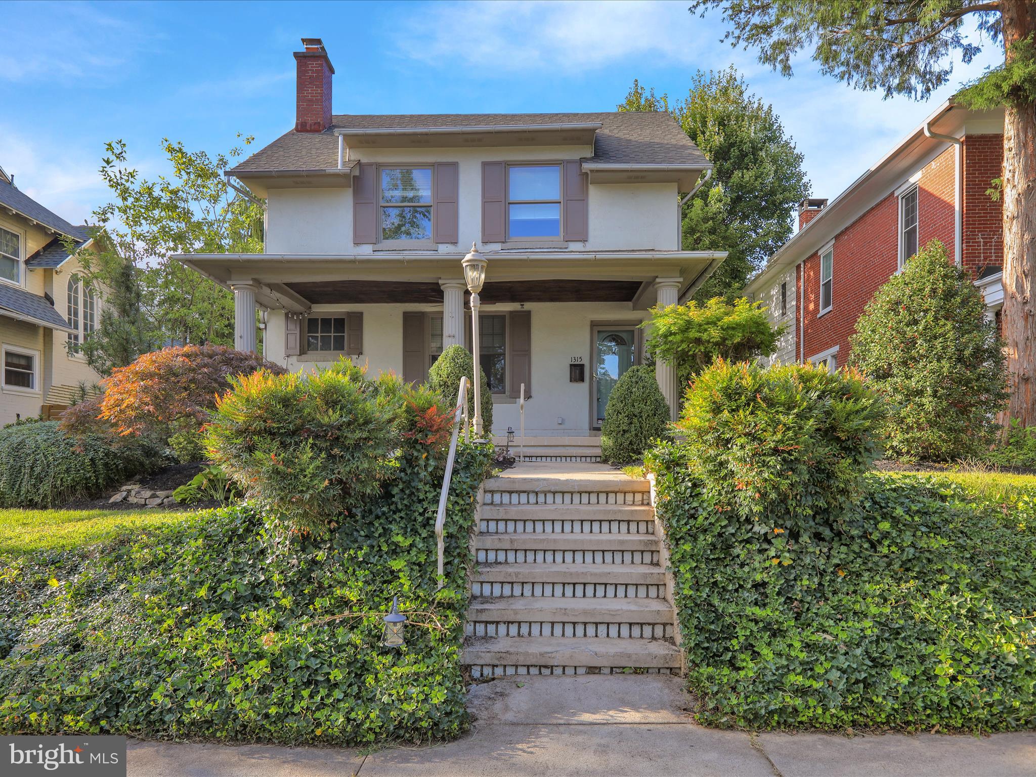 On the Wyomissing parade route sits this beautiful four-bedroom home, blending timeless charm with modern updates in the Wyomissing School District. The main level features a spacious living room with a cozy gas fireplace and built-ins, as well as a bright white kitchen with all appliances, open to the dining room for easy entertaining. Upstairs, you’ll find three bedrooms—each with a closet—and an updated shared full bath. A conveniently located laundry room with cabinets is also on this level. The entire third floor is dedicated to the primary bedroom, offering a full bath with double vanity and walk-in shower. Additional living space is found in the finished basement, which includes a large family/rec room, a private office with built-in desk and cabinets, a storage area, and a half bath. Outdoor living is equally impressive with a covered front porch, a large rear deck, and a fenced yard surrounded by mature landscaping. Completing the property is a two-car detached garage plus additional off-street parking at the rear. Don’t miss your opportunity to own this charming Wyomissing home—call today to schedule your private showing!
