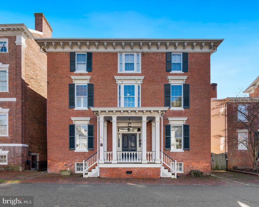 Rare waterfront residence/"pied-e-terre"  in historic downtown Chestertown situated within in an iconic late 1800s Georgian brick beauty. Built as one of the towns' first prominent apartment buildings, it was restored and converted to a six-unit condominium in the early 2000s. This second-floor gem is like a multi-carat diamond with wonderful clarity and cut.  Featuring two bedrooms and two hallway baths, the Water Street side (front) living room provides a newly upgraded gas fireplace and is perfect for warm welcoming of guests, cozy reading, quiet relaxation, and perhaps the occasional sleep over with the right sofa bed. The Chester River side (rear), with its set of French doors opening to a fully screened-in porch is a most inviting space for cooking, eating, mixing of cocktails, watching movies, gazing at the incredible sunrises or moon-lit water.  The shared dock provides access to a boat slip and even some Adirondack chairs to enjoy the many community events and water activities. Or just simply relax. The recently re-landscaped backyard provides for outdoor grilling, lounging, and a place for your bicycles and kayaks.