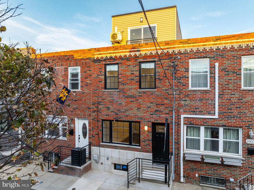 Discover life in East Passyunk, Philadelphia’s most vibrant neighborhood, renowned for its exceptional food and drink scene. Located on a charming street, this newly renovated townhome offers modern luxury in a prime location. Benefit from a 10-YEAR TAX ABATEMENT while enjoying this beautifully updated residence.  Step inside to find gleaming hardwood floors that flow seamlessly through the open floor plan encompassing the living, dining, and kitchen areas. The kitchen is a chef’s dream, boasting quartz countertops, a tiled backsplash, sleek white shaker cabinets and stainless steel appliances. A convenient powder room is located on the main floor, and the kitchen opens directly to a fenced-in yard, perfect for barbecues and entertaining. Upstairs on the second floor, you’ll find two bedrooms with ample closet space and a full bathroom. The hallway bathroom features a fully tiled bathtub/shower, a dual vanity sink, and high end fixtures. The 3rd floor hosts the bright and airy primary suite equipped with high ceilings, a walk-in closet and a luxurious ensuite bathroom finished with floor-to-ceiling tiles, a stand-up shower and a dual vanity. There is also a balcony in the primary suite for additional outdoor space. The partially finished basement can serve as an additional flex space and extra storage area. You’ll be within walking distance to everything the Avenue has to offer. Schedule your private tour now!