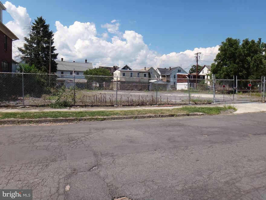 0.27 acre level fenced lot. All utilities on site. Ideal for multi-family investment building site.
