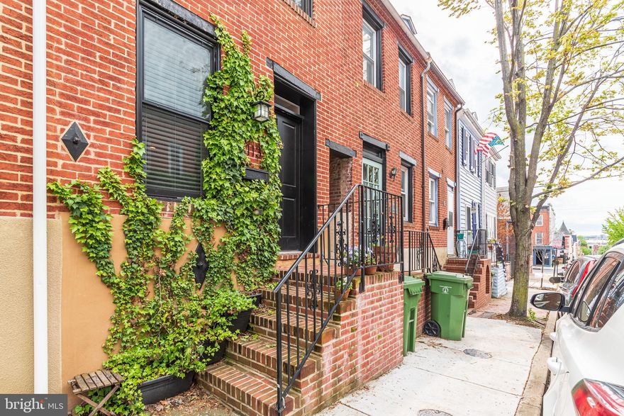 ***MOTIVATED SELLER***Start your summer off in style! This was totally renovated from top to bottom in 2013. The home has 3 finished levels of living, 3 true bedrooms, 2 full baths, a tier roof deck, fenced in patio AND 2 car parking pad. Each bedroom offers good space whether you're living alone or with others. Since this house has 2 upper levels and a full bath on each, it makes for great privacy. The gourmet kitchen has granite counters, stainless steel appliances, and space for a table and chairs. The living room is at the front entrance but there's also a separate dining area. The  house sits just east of the Cross Street market and just south of the waterfront harbor. Enjoy the sights from the roof deck. PARKING??? Not only does this house have a parking pad, it also has a fenced in patio perfect for main level cookouts and for your pooch! This can also be easily made into 2 car parking with the fence removal.  ***Be sure to watch the virtual tour, pardon the rainy day***