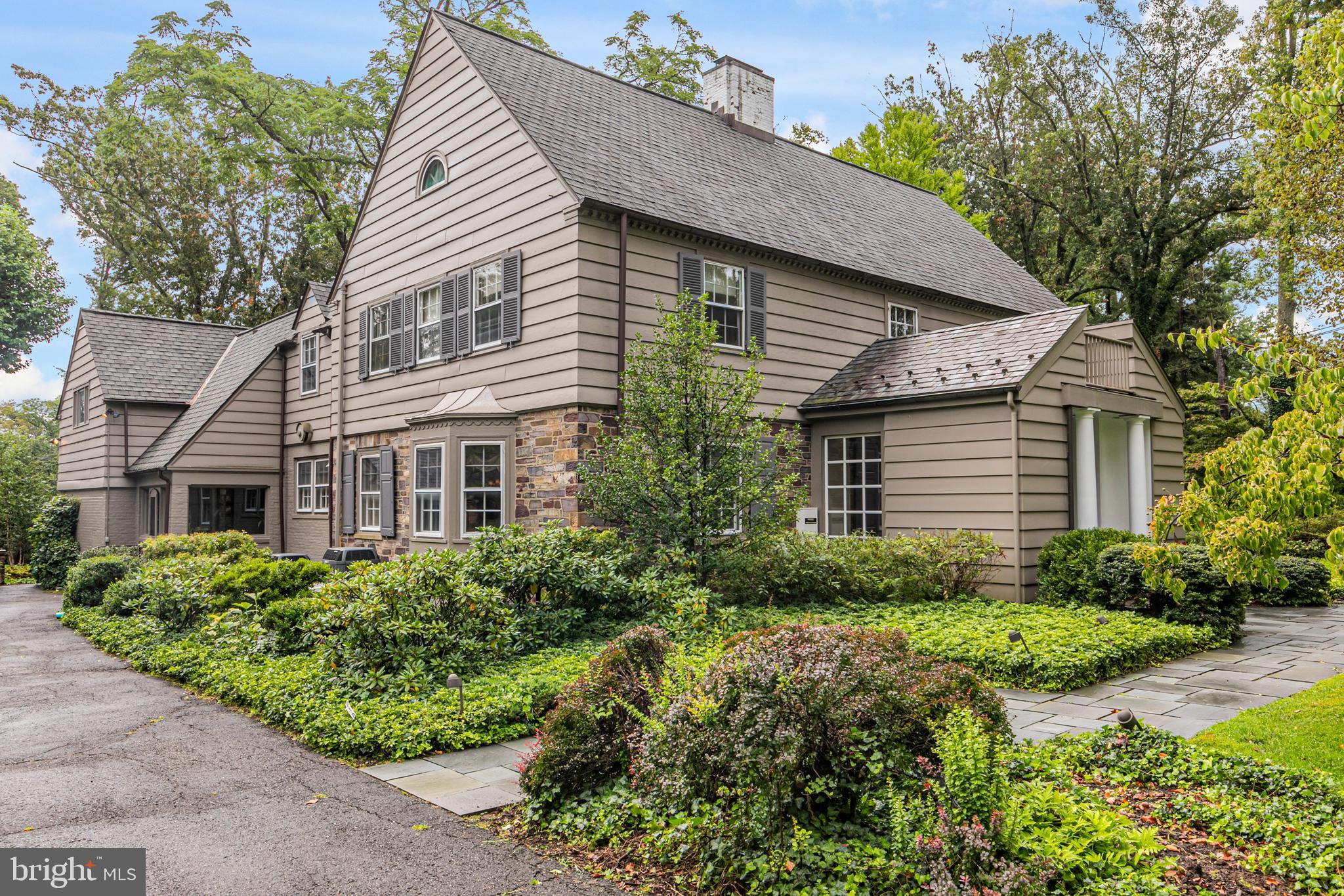 Standing on just over an acre immediately adjacent to the glorious meadow that introduces the world famous Institute for Advanced Study, this gracious 1930’s home deftly blends traditional polish and contemporary edge. Not only was the house strategically enlarged, an incredible studio was built behind the garage. With a 16-foot peaked ceiling, a commanding stone fireplace and inspiring garden views, it is an enviable place to dive into a project, harness your creativity or host lively discussions. Even guests with the highest standards would be thrilled to take up temporary residence in this dramatic space. The main house is filled with rooms large enough for festive entertaining, yet completely comfortable for a quiet evening alone. The boldly hued study is especially cozy and unconventionally sophisticated. The central kitchen is thoughtfully laid out with both butler’s and walk-in pantries and an open flow into the window-lined breakfast room. French doors here and in the family room encourage enjoyment of the stone patio and delightfully private backyard. Each of four bedrooms displays individual character and desirable features, like walk-in closets, built-ins and soaring windows. While it already offers a walk-in closet, the main suite with adjoining office poses several options to elevate it to the next level. A basement game room with half bath and a handsome brick mudroom are valuable spaces not to be overlooked. Stroll the Institute woods, explore IAS’s renowned wine list, perfect your swing at Springdale Golf Club - these diversions and more are right at the edge of this storied Princeton neighborhood.
