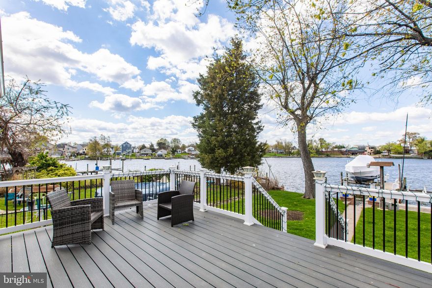 ***OPEN HOUSE; SUNDAY, 5/17; 11AM-1PM*** Affordable Waterfront Living Awaits You on Bear Creek! *** NO FLOOD INSURANCE REQUIRED*** 
Welcome to a truly remarkable waterfront retreat! This stunning, property offers the perfect blend of modern comfort and nautical charm. With breathtaking water views and sunsets, with direct access to the creek, you’ll feel like you're on vacation every day. **  
STANDBY FOR UPDATED PHOTOS, SHOWING NEW MODERN UPDATES ON 5/15 ** Freshly Painted Throughout, 
Property Highlights:
50' Private Pier: Ideal for boating, fishing, or simply enjoying the serene waterfront setting.
Modern Updates Throughout: Every detail has been thoughtfully upgraded for style and convenience.
New White Shaker Kitchen Cabinets (2024), Upgraded Quartz Countertop and sink (May 2026), Blue Glass Back Splash (May 2026); Sliding Glass Doors (2) - (2018); Trex Deck (2018); Bulkhead (2023); Siding and Roof (2023); Water Heater (2025); Updated Electrical to Garage (May 2026); Basement Waterproofing w/ Warranty (2026)
Stainless steel appliances, including a new dishwasher (May 2026) and microwave (2024); Perfectly designed for cooking and entertaining. Interior Features
Main Level Primary Suite: Sliding glass doors lead to a Trex deck—your front-row seat to colorful sunsets!
Gorgeous, updated ensuite bathroom for a spa-like experience. Lofted Second Bedroom/Den & Third Bedroom: Both offer water views from the second level.
Second Full Bathroom with Shower: Conveniently located on the main level, perfect for guests and family.
Details You’ll Love: Beautiful Wood Floors: Warm and inviting, flowing throughout the main level.
Whether you’re hosting gatherings on the spacious deck, enjoying the tranquil pier, or cozying up indoors, this Bear Creek gem is the epitome of waterfront living. Conveniently located minutes from 695, Tradepoint Atlantic, Baltimore City yet feels like you've gotten away from it all!