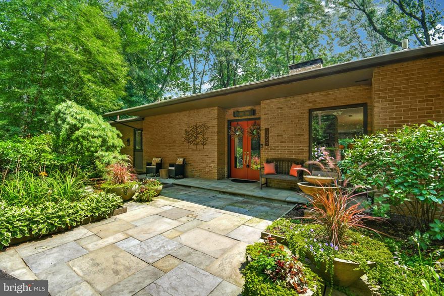 ABSOLUTELY STUNNING Mid Century Modern, Completely Renovated Home (Even has an Elevator) on Sought after Valley Forge Mountain in the Award Winning Tredyffrin Easttown School District! Open Concept Features Multiple Sliding Glass Doors Upstairs and Down to both Composite and Stone Decks which Overlook  this Fully Fenced Property, The Primary Bedroom has a Large Walk In Closet with Builtins Galore, It's Bath Features Double Sinks, Oversized Walk in Shower and Granite Vanity Top, Radiant Heat Floors;  There is a Second  Bedroom with it's own Radiant Heated floor Bath on this Floor. Magnificent Chefs Kitchen has a Large Double Sink Under a Wall of Windows plus an Additional Prep Sink in the Large Island. The Kitchen also Features a 6 Burner (Plus Griddle) Wolf Cooktop set in a Massive Island that Seats  5-6  Guests. There is also a Built in Knife Block, Spice Drawer, Instant Hot Water Dispenser and Wolf Double Convection Wall Ovens. 
The Living Room Features a Wood Burning Fireplace in a Gorgeous Stacked Stone Wall that is also Featured in the Light Filled Stairway and Lower Level Family Room; The Dining Area Features a Built in Backlit China Cabinet with Wine Frig,  and a Wall of Windows with views Beyond.  There is Storage Galore Including  a Hall of Cabinets Leading to the 1/2 Bath & Laundry, 3 Cedar Closets and 2 Add'l Storage Rms.  The Lower Level Features Two Bedrooms with Ensuite Baths (w/ Radiant Heated Floors), one with Deck Access, a Large Game Room with Built In  Wet Bar with Wine Cooler and Refrigerator, a Bonus Room (Office or Exercise Room) and a Family Room with Wood Burning Fireplace that Opens to an All Season Room with Interchangable Windows and Screens PLUS a Gas Fireplace.  This is the Perfect Entertaining Home, Winter/Summer,  Inside or Out. This  Gorgeous Gated, Professionally Landscaped Property is a 5 Minute Walk to the Horshoe Trail Head and Valley Forge Park and Close to the Wonderful Sunbowl, the VF Mountain Swim and Tennis Club! This Home Will Not Disappoint!