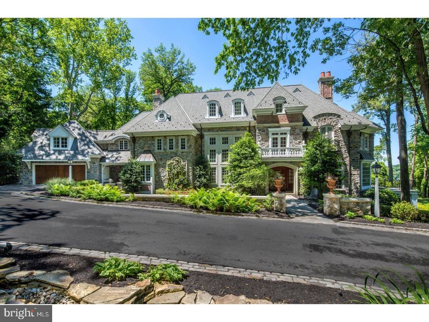 Gorgeous Builder's Residence with Every Upscale Amenity. Only a prominent builder could create such a fabulous luxury residence. Originally designed by architect Charles Gilbert & renovated by architect Rene Hoffman, this grand estate is exquisite. The spectacular property of 3+ acres includes beautiful landscaped gardens, a tennis court, spring house, barn w/storage area & 2 garage spaces in addition to the 2-car attached garage. The interior living spaces were brought to life by interior designer Barbara Eberlein with the finest craftsmanship & finishes. Live in splendor & solitude in a superior Main Line locale. A stone & brick wall envelopes the breathtaking exterior w/a Belgian block banded driveway. Stone pillars & flagstone walk precede the main entrance which leads to a soaring foyer w/a coffered ceiling reception hall & indoor garden w/fountain which brings the beauty of nature in. Wide hallways guide you to the living & entertaining spaces. Entertain guests in the formal living room centered by a fireplace. Converse over cocktails in the restaurant-quality bar w/marble floors, Sub-Zero fridge, ice maker, wine fridge & magnificent millwork. Or step out to the African wood deck off the living room. The sun-filled fireside library w/built-in bookshelves offers a wet bar & under counter fridge for enjoying beverages while reading. Serve meals in the sophisticated dining room w/double sets of doors that lead out to gorgeous rear patio. The gourmet kitchen is state of the art, featuring custom cabinetry, pillowed limestone floors, Wolf appliances & a workstation desk. A breakfast room overlooks stunning property through a triple window. Relax with everyone in the charming family room with beamed ceiling & walnut floors. Movie nights are out of this world in the most elaborate home theater w/stadium seating for 12 & electric blackout shades. Guest & family powder rooms, a mud room & work room complete the 1st-floor living area. Front & back stairs ascend to the 2nd floor that includes a one-of-a-kind master suite w/sitting room, fireside BR, barreled ceiling hallway, phenomenal his/hers custom fitted closets & opulent his/hers spa baths. There are 4 additional bedrooms, each with its own bath. A vaulted bonus room w/built in desk & ceiling fan + laundry room also occupy the 2nd level. A music system, 7-zone HVAC & backup generator which services the entire property are among the many other highlights. This home is extraordinary in every way!
