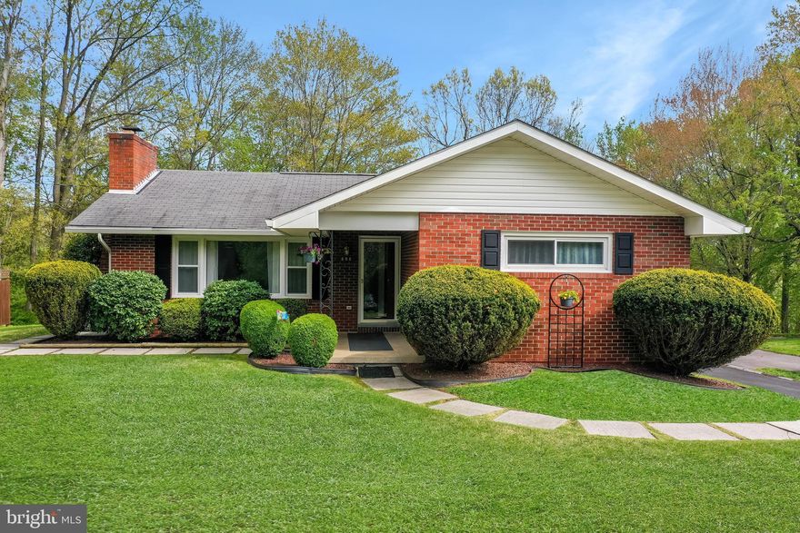 This large rancher offers brick construction, replacement windows, central air, fireplace, french doors opening onto a screened porch w/hot tub, partially finished basement, and an attached in-law suite.  This is a must see