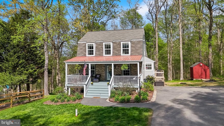 Welcome to this meticulously maintained home in Chesapeake Beach, offering nearly 2K sqft of living space on over an acre of beautifully landscaped land, and access to Bayfront Park! This property stands out with its oversized and freshly painted front porch, a stone façade, expansive driveway with ample parking, and no HOA - perfect for RVs, boats, and all your toys. The outdoor space is a true highlight and so rare for the area, featuring raised fenced garden beds, a mature peach tree, and a lush front yard. A brand-new BAT system (2026) has created a large, flat backyard with scenic creek views. Inside, pride of ownership shines throughout with hardwood floors, recessed lighting, newer carpet (2021), and a SMART front door. The main level includes a bedroom and full bath for added flexibility. The kitchen offers quartz countertops, a stunning tile backsplash, a gas stove, soft-close cabinets, pantry storage, and a Bosch dishwasher (2022). Upstairs are two spacious bedrooms and a shared full bath. The fully finished basement features tall ceilings, LVP flooring, a walk out basement, an additional bedroom, a full bath with a custom glass shower surround, storage area, and a large laundry room with folding space, and a new washer & dryer. Hot water heater replaced in 2024. Enjoy the best of coastal living just minutes from the boardwalk in North Beach and an easy commute to Annapolis, Washington DC, Joint Base Andrews and more!
