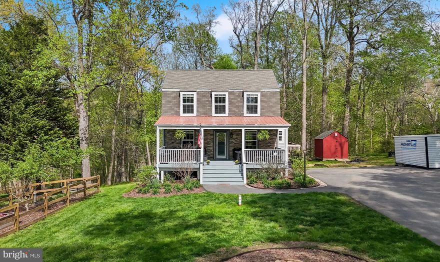 Welcome to this meticulously maintained home in Chesapeake Beach, offering nearly 2K sqft of living space on over an acre of beautifully landscaped land, and access to Bayfront Park! This property stands out with its oversized and freshly painted front porch, a stone façade, expansive driveway with ample parking, and no HOA - perfect for RVs, boats, and all your toys. The outdoor space is a true highlight and so rare for the area, featuring raised fenced garden beds, a mature peach tree, and a lush front yard. A brand-new BAT system (2026) has created a large, flat backyard with scenic creek views. Inside, pride of ownership shines throughout with hardwood floors, recessed lighting, newer carpet (2021), and a SMART front door. The main level includes a bedroom and full bath for added flexibility. The kitchen offers quartz countertops, a stunning tile backsplash, a gas stove, soft-close cabinets, pantry storage, and a Bosch dishwasher (2022). Upstairs are two spacious bedrooms and a shared full bath. The fully finished basement features tall ceilings, LVP flooring, a walk out basement, an additional bedroom, a full bath with a custom glass shower surround, storage area, and a large laundry room with folding space, and a new washer & dryer. Hot water heater replaced in 2024. Enjoy the best of coastal living just minutes from the boardwalk in North Beach and an easy commute to Annapolis, Washington DC, Joint Base Andrews and more!