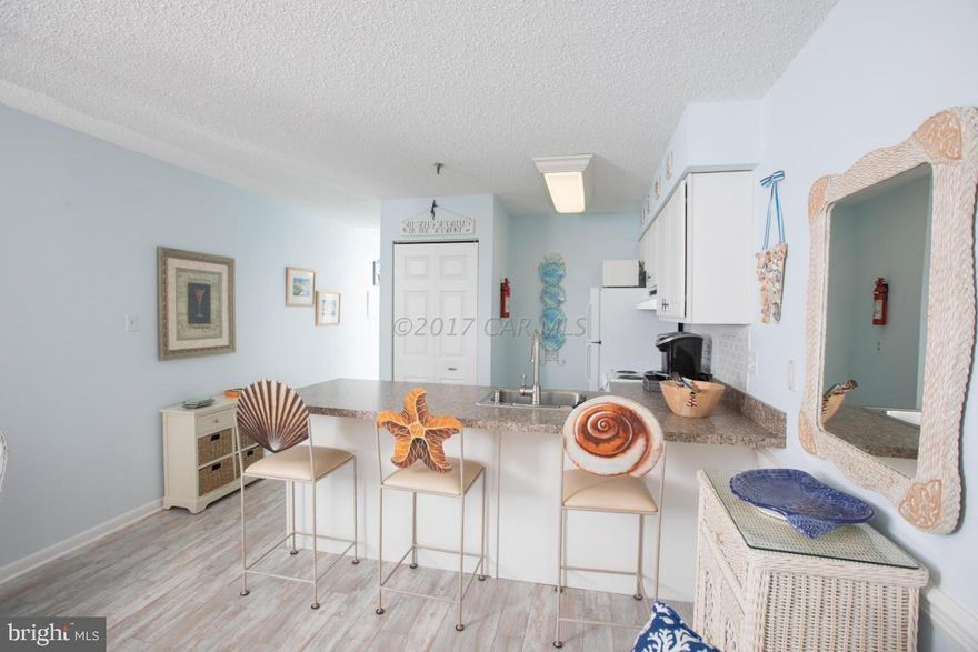 Gorgeous fully renovated (2014) ocean block efficiency located in popular and sought-after mid-town - The Hub For Most Major OC Annual Popular Events! This condo in Convention Center Villas proudly boasts attention to detail and pride of ownership with  updated flooring, tile, bathroom, appliances, counter, cabinets, fixtures, hot water heater, washer/dryer and disposal. Plus bonus of new a/c-heating wall unit (2020). Looks and feels like a model home-Beautifully furnished, including designer sleep sofas (2), rugs, bar stools and many other fabulous beach themed decorative items. Sit on balcony and people watch, enjoying the views of beach and bay.  Perfect for the Air Show,  Fireworks (Watch Jolly Roger's from Balcony!) and other annual events, too. Storage on balcony as well as plenty of storage in unit. Under building permit parking. Owners never rented, but would make a great rental being so convenient to popular restaurants (Coconuts, Belly Busters, 45th St Village, Barn 34, OC Wasabi, Anthony's Deli...and more), mini-golf, entertainment, shopping and Convention Center. A perfect beach getaway and at a perfect price! This is turn-key and ready for new buyers to enjoy for the rest of summer and beyond!