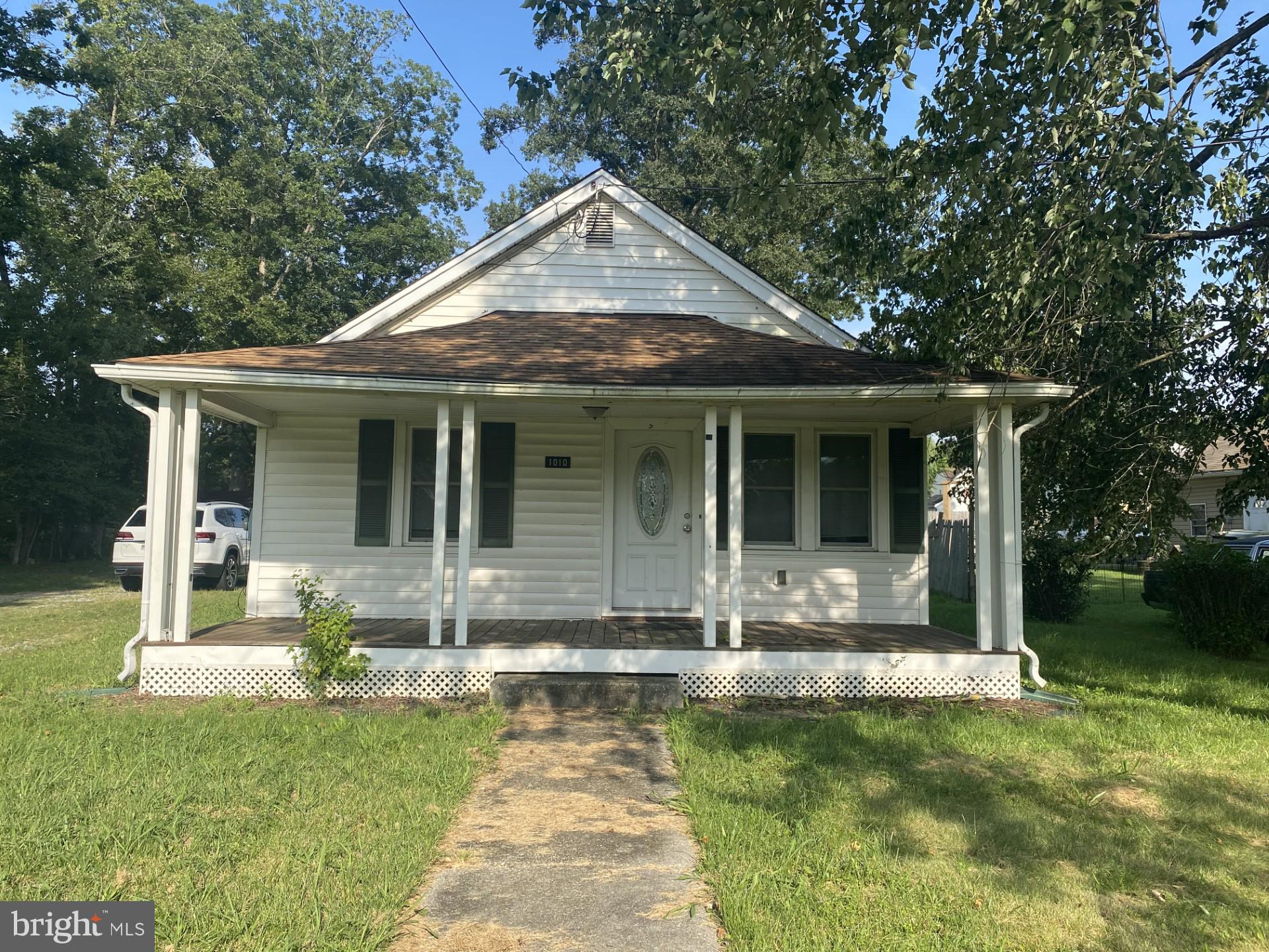Charming Rambler in the Heart of La Plata!
This mid-20th century suburban ranch-style home offers timeless charm with a single-level layout and a modest, efficient footprint, perfect for first-time buyers or those looking to downsize, with your TLC and personal touches the potential is limitless. Just shy of 1,000 sq ft, the home features 2 bedrooms, 1 full bath, a living room adjoining the kitchen/dining area, laundry room and a bonus room off the back of the house for extra living space.
Enjoy the inviting front porch, ideal for relaxing mornings or quiet evenings, and take advantage of the spacious backyard complete with a cinderblock shed for added storage. Practical and a classic design make this home both low-maintenance and full of character. Conveniently located close to all that La Plata has to offer, shopping, dining, and community events - this property is a wonderful place to call home. Home is being SOLD AS IS.
