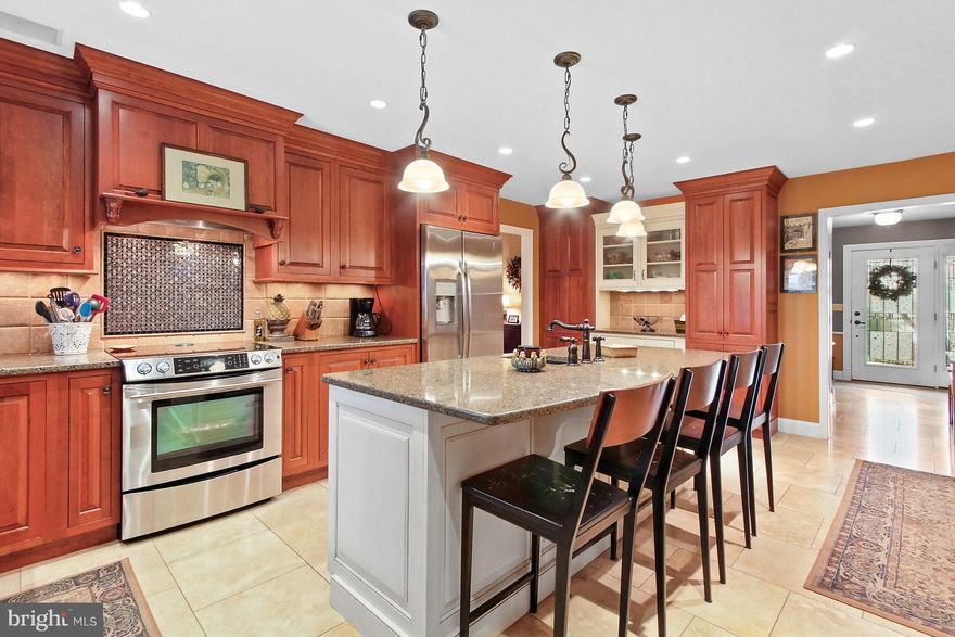 Where to start on this amazing home in Wilson SD! Almost 4000 sq ft of living space, 1.3 acres of space outside, fully fenced inground pool, built in firepit, peaceful pond, the list goes on. This home offers so much value for a great price. Inside you will be wowed by the artistic foyer with easy to clean ceramic tile flooring that flows throughout to the beautifully remodeled kitchen. The spacious kitchen boasts cherry cabinents, modern granite counter tops and an amazing focal piece above the stove. The large contrasting color island offers lots of extra counter space as well as eating space for your informal meals. Right next to the kitchen is a warm and inviting sun room equipped with a bar making it a great area to entertain. The main floor also includes a spacious family room with a vaulted ceiling and stone fireplace, a den or office, a formal dining room, a powder room and a laundry room. Upstairs you will find the sizable master suite. The master just keeps going, featuring a sitting area/dressing room area, 2 walk in closets, and a very large master bath. The en suite is equipped with double sinks, a separate shower/toilet area, and a large soaking jetted tub. Upstairs includes 3 more spacious bedrooms and a hall bath. Need more space?  The lower level is finished as well to give more living space to enjoy with family and friends. Outside is a true oasis on 1.3 acres of space. There is something for everyone! Let's start with the spacious covered patio which is great for outdoor entertaining space. That will come in handy when all of your family and friends want to come enjoy your large, fully fenced indoor pool. When you are not having pool parties, there is a great space around the pond that is beautifully landscaped for relaxing with a good book. During the cold months, you and your family and friends can enjoy roasting marshmallows around the built in stone fire pit. This home is a must see! It really offers a ton of value and opportunity in a great neighborhood and School District. Come see for yourself!