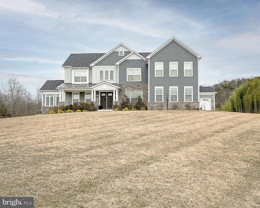 Introducing a superbly luxurious Craftsman Home sitting on a wonderful 2 acre partially wooded lot.  This home has a wonderful floorplan with hardwood floors throughout the main level and upgraded Luxury vinyl tile throughout the basement.  Sitting perfectly atop a hill overlooking the cul-de-sac awaits this masterpiece.  As you drive up the extended driveway that can easily hold a dozen cars for those occasional events/parties you decide to host.  You will notice the large front porch that points southwest and catches the evening sunset.  The landscaping is well thought out and the home sits well back from the main road to allow you to take it all in.  There is a parking pad adjacent to the 4-car garage as well.  From the entryway into the large foyer and Living room to the formal dining room and solarium, you will feel the space of the home and love the feeling you get when you enter from a long day doing whatever your do.  But wait!!!... the kitchen is a true masterpiece complete with its subzero refrigerator, Wolf cooktop and double oven and this super huge island all surround by large light filled windows.  I can go on and on if you want, but to be honest, my words cannot do this home justice.  Please take a look a the 75 pictures to get a feel for what this home has to offer.  And yes, the is a fully furnished gym and a golf simulator in addition to a full wet bar, full bath and sleek pool table in the 'Man & Woman' cave.  Come see this home and I am sure you will want to buy it