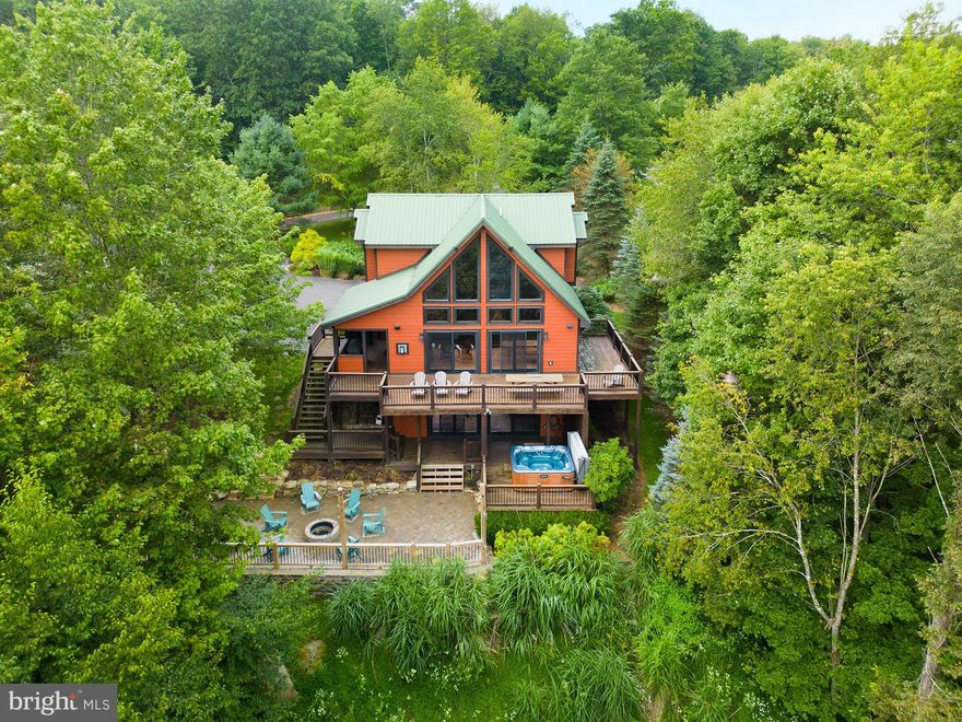 If you are looking for a stunning mountaintop home with lake and mountain views, this is it! This chalet offers five bedrooms, an open floorplan, hardwood floors and two propane fireplaces . The beautiful windows bring the outside in, making this the ideal home to enjoy with family and friends year round. The outside space is just as pleasing with a spacious lake view deck, a new lower level patio & fire pit, and an outdoor hot tub. The location is also hard to beat, just minutes to Lodestone Golf Course, Wisp Ski Resort and Deep Creek Lake. Call today to preview this great home!