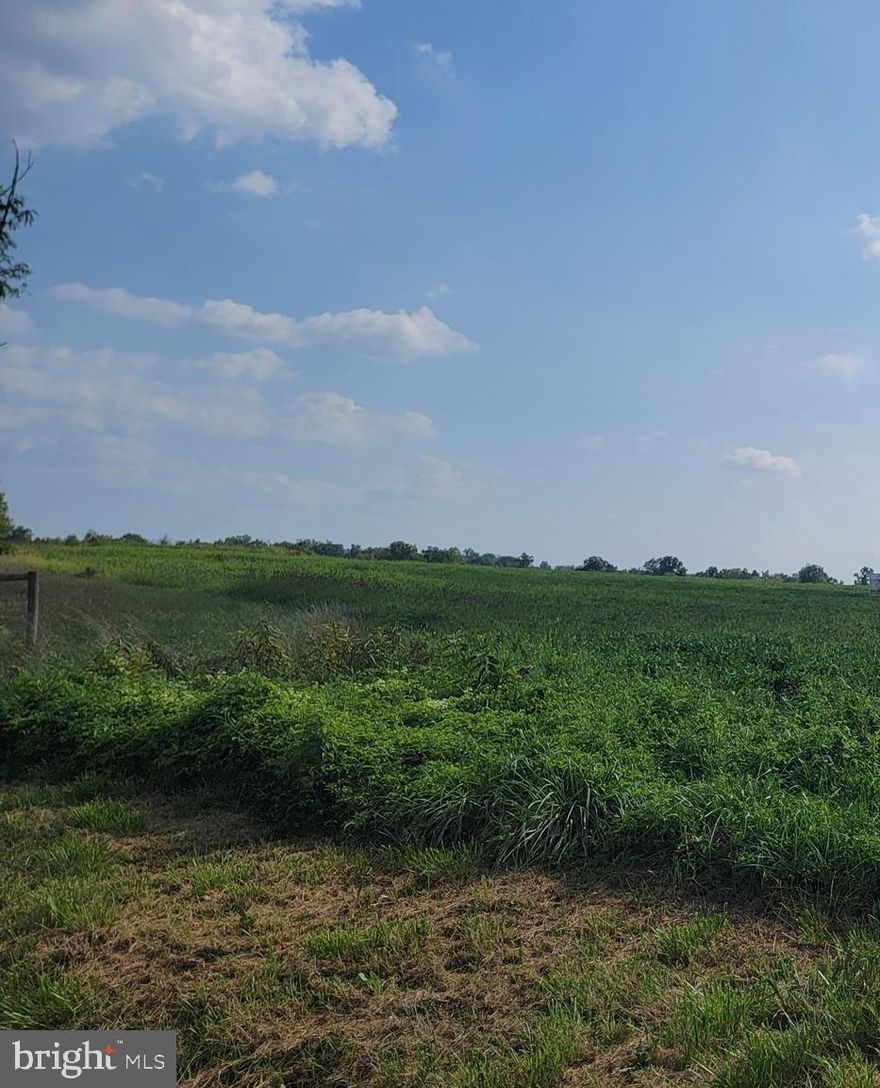 Large open 10.01 acre lot with views.  Lot has a well.  Currently in clean and green.  Has seven  older sand mound percs.  Buyer will need to confirm current status of percs. Lot is currently in crops until October/November.