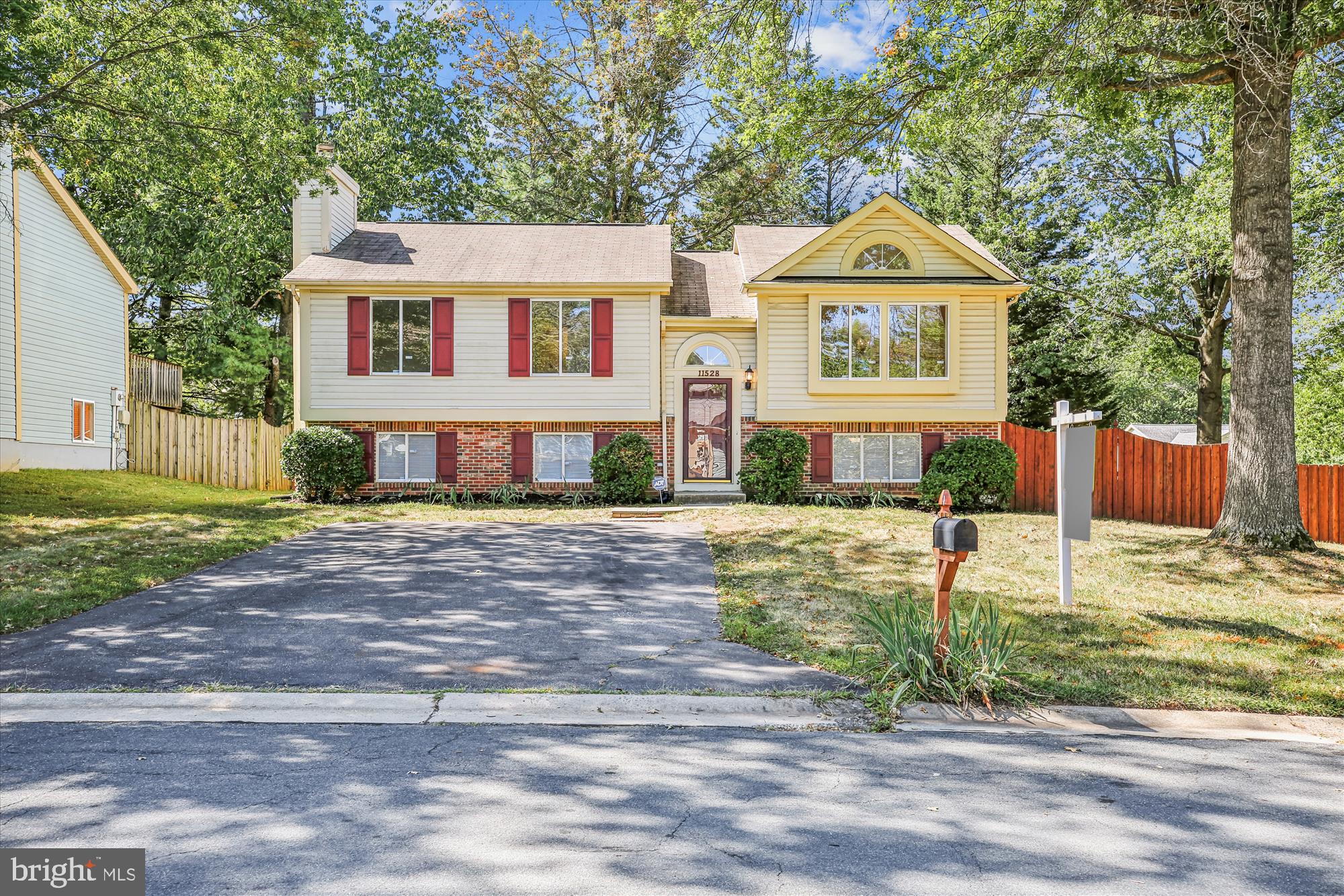 Beautiful split foyer home in Germantown featuring 3 beds and 2.5 baths. ***The main floor boasts an open floor plan with a completely remodeled kitchen, new wall-to-wall carpet, and fresh paint throughout. *** A spacious living room with a picture window fills the home with natural light, ***the dining room with a sliding glass door opens to a back deck with stairs leading to the fully fenced backyard. ***All bedrooms and two full baths are located on the main level. The lower level offers a large family room with front-facing windows, a cozy fireplace, a utility room, half bath, and a rec room that could be converted into two additional bedrooms with the addition of an escape window. ***The fully fenced backyard includes a gate to the front and a few trees providing plenty of shade.