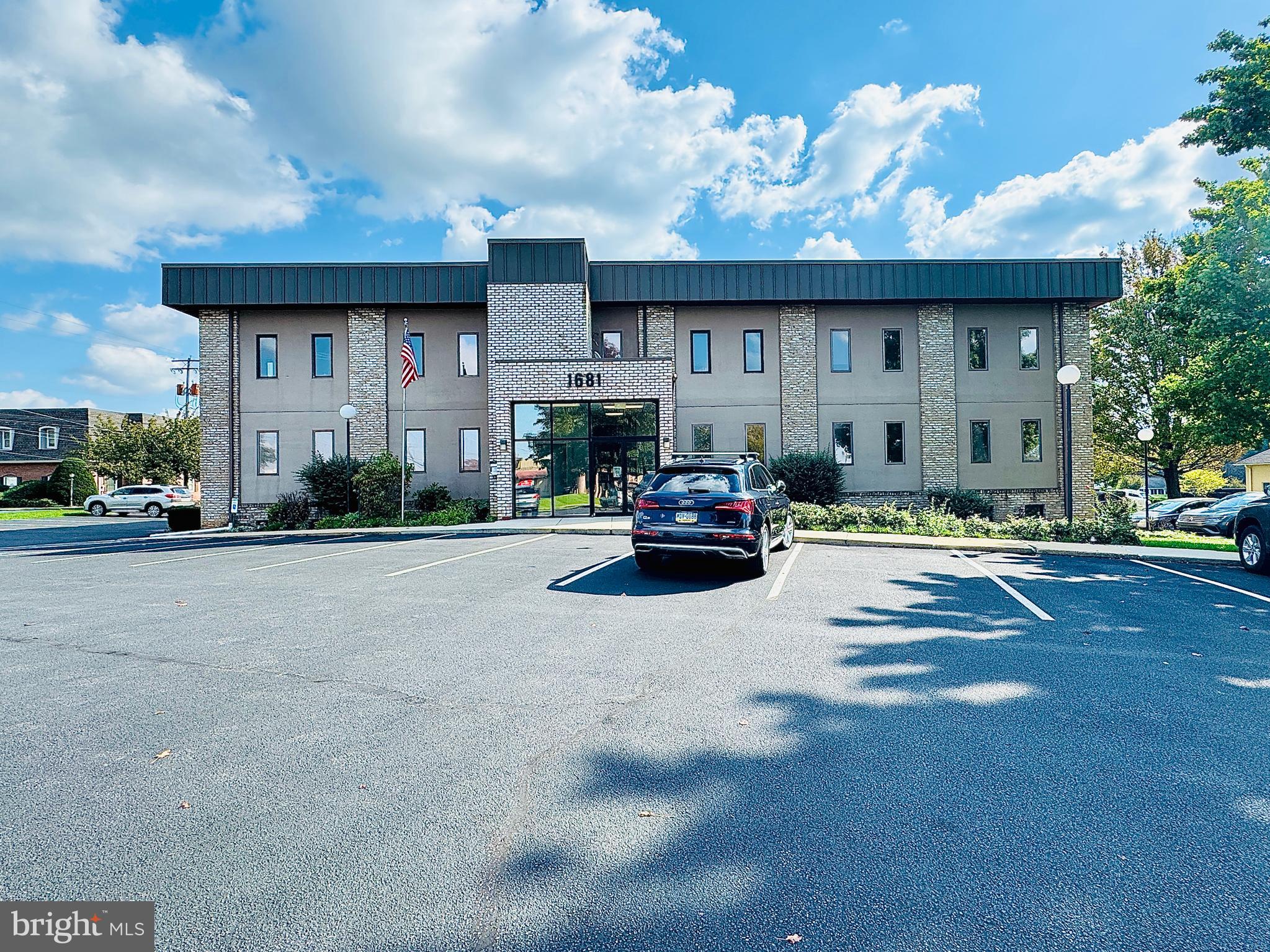 This combined office space at Ridgeview Executive Park totals ±2,816 square feet on the first floor, featuring a suite entry door just off the building entrance. Tenants have the option to connect the two adjoining suites with an interior door or opening, creating a seamless flow between the spaces. Recent upgrades include fresh paint and carpet in the larger suite, along with abundant windows that provide ample natural light. The suite also boasts a private restroom and the convenience of roughed-in plumbing for easy kitchen creation. Prominent signage on the building monument sign, lobby directory, and suite doors. Modified gross rent: $3,749.97/month. Tenant pays electric, phone/internet, suite janitorial, and insurance.