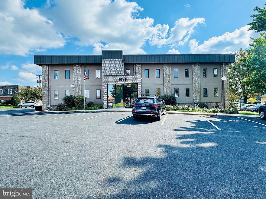 This combined office space at Ridgeview Executive Park totals ±2,816 square feet on the first floor, featuring a suite entry door just off the building entrance. Tenants have the option to connect the two adjoining suites with an interior door or opening, creating a seamless flow between the spaces. Recent upgrades include fresh paint and carpet in the larger suite, along with abundant windows that provide ample natural light. The suite also boasts a private restroom and the convenience of roughed-in plumbing for easy kitchen creation. Prominent signage on the  building monument sign, lobby directory, and suite doors. Modified gross rent: $3,749.97/month. Tenant pays electric, phone/internet, suite janitorial, and insurance.