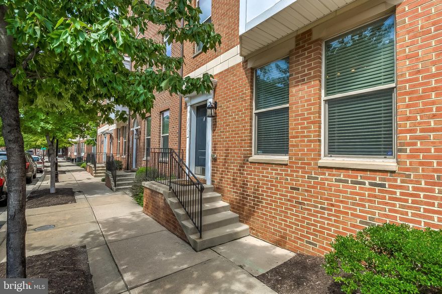Park your cars in this home's 2 car garage and walk anywhere in Baltimore, from this fabulously convenient location. This home is 100% move in ready with a fresh coat of paint, new carpet, and new flooring on the entrance level. The open concept main living level is bright and inviting with hardwood floors, recessed lights, a half bathroom, a large hidden pantry, and access to a deck with low maintenance composite decking. The large master suite is a private oasis with a walk in closet, ensuite bathroom with a soaking tub and double sink vanity, a sitting area/ office space, and private balcony. The second bathroom is conveniently located in the hallway with easy access for occupants of the other two bedrooms. Entrance level is a fantastic flex space, perfect for a den, pool room, play room, office, or anything that suites your needs. 2 garage has additional storage space and can fit 2 additional vehicles in the parking pad behind the garage door. Fees include exterior maintenance of the structure (including the roof!) and grounds, sewer, and snow removal. Vacant property, so you can easily and safely view this property.