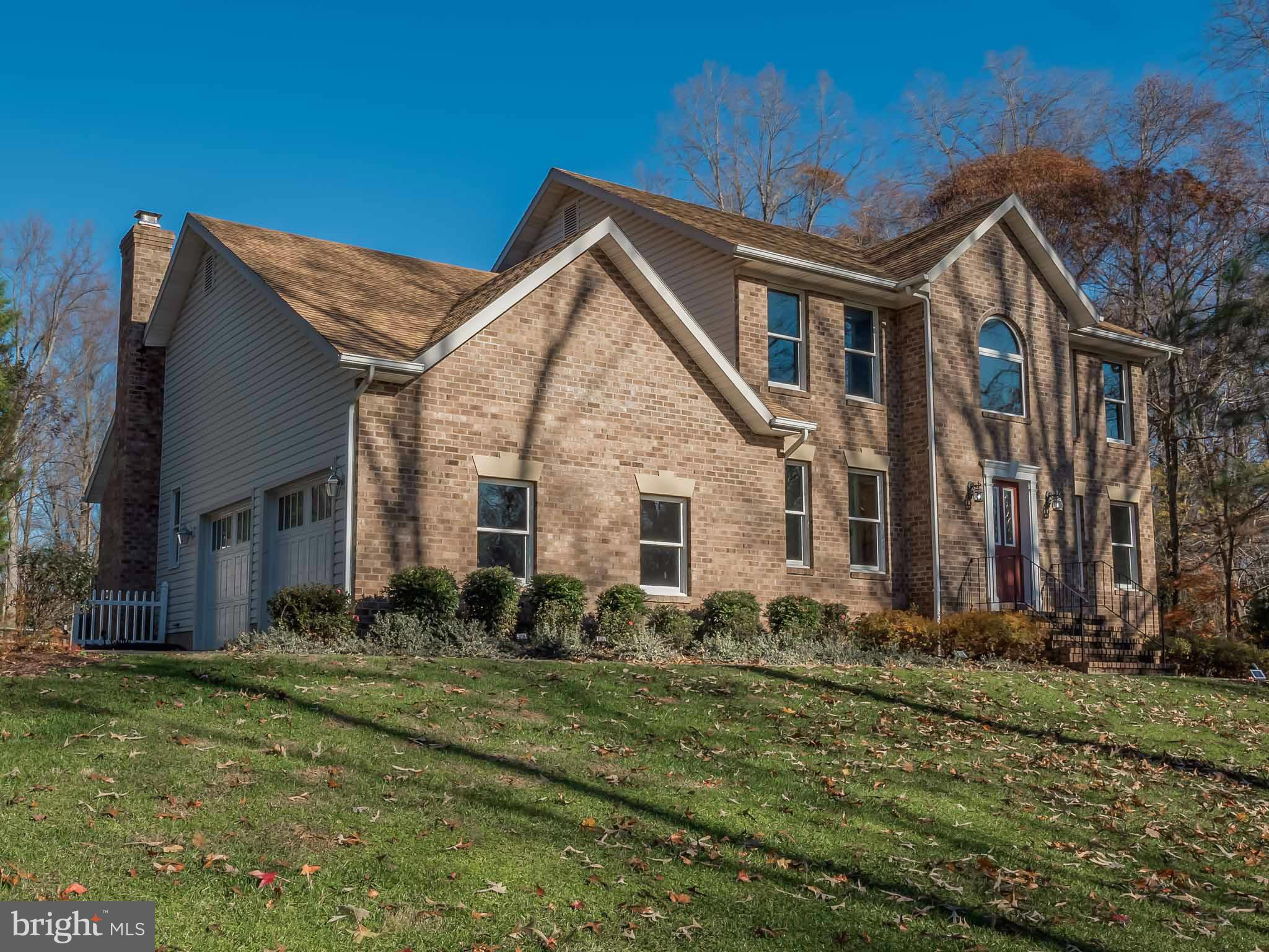 Over 3600sq ft on 1 acre. Heart of the home is remodeled Chef's kitchen w/ custom soft close cabinets, built-in pantries, DCS Professional 48-Inch 6-Burner LPG Range w/hood in center island, stainless steel appliances, breakfast bar, quartz countertop, family room off kitchen w/vaulted ceiling, brick fireplace w/pellet stove, skylights, hardwood, living, dining & study, basement, new HVAC