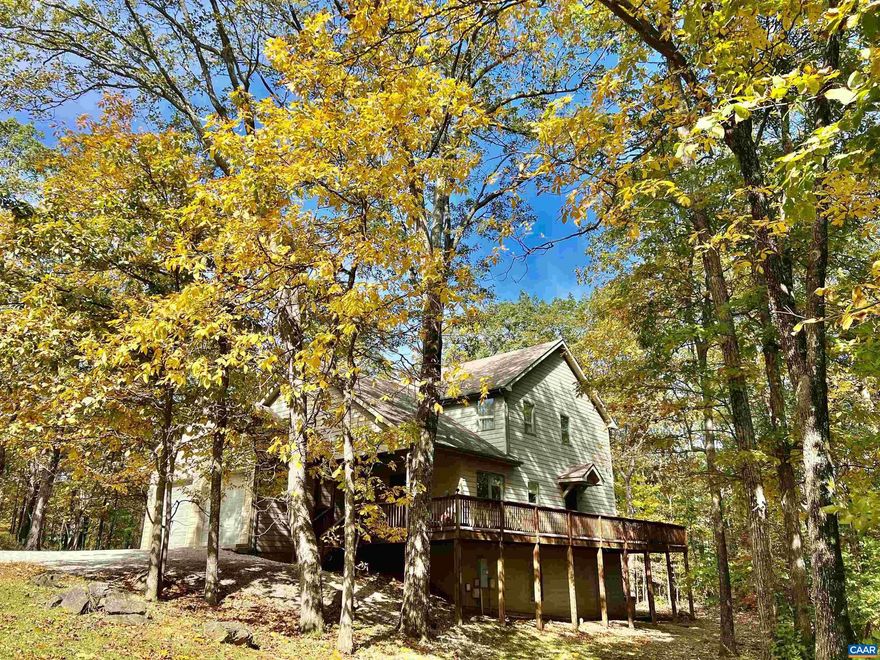 Located on a corner lot with more acreage than most Wintergreen lots, this mountain getaway has perfect features for a large family or for a short-term rental property. The driveway access is easy, flat, and wide, and getting into the two car garage is a breeze. There are minimal steps to get inside, with everything you need on the main level including kitchen/living room, laundry, primary bed/bath, access to the wrap-around deck. There are three areas used for living rooms spaces/rec rooms, so lots of room to spread out?main level living room, basement rec room with wet bar and third dining table, garage with ping pong table and couch. The hot tub and gas fire pit complete the whole mountain experience! Not only does this home have five bedrooms and ample gathering space, it's ready for use for the winter ski season with the many fun features ready to go!,Granite Counter,Wood Counter,Fireplace in Living Room,Fireplace in Rec Room